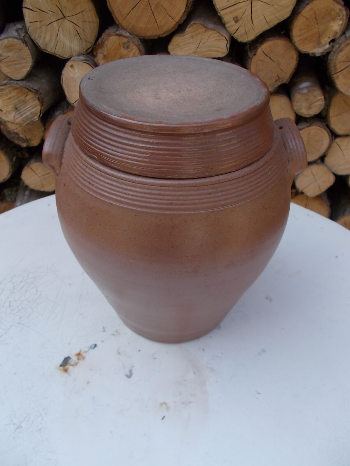 Old sandstone pot and its lid