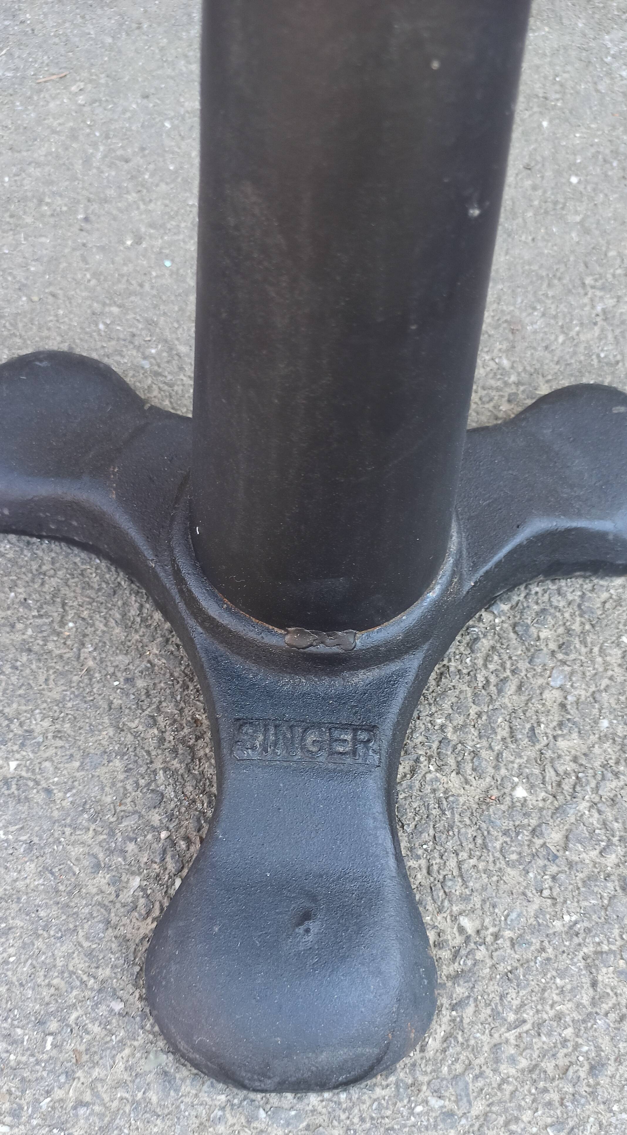 Height-adjustable leather stool with cast iron base
