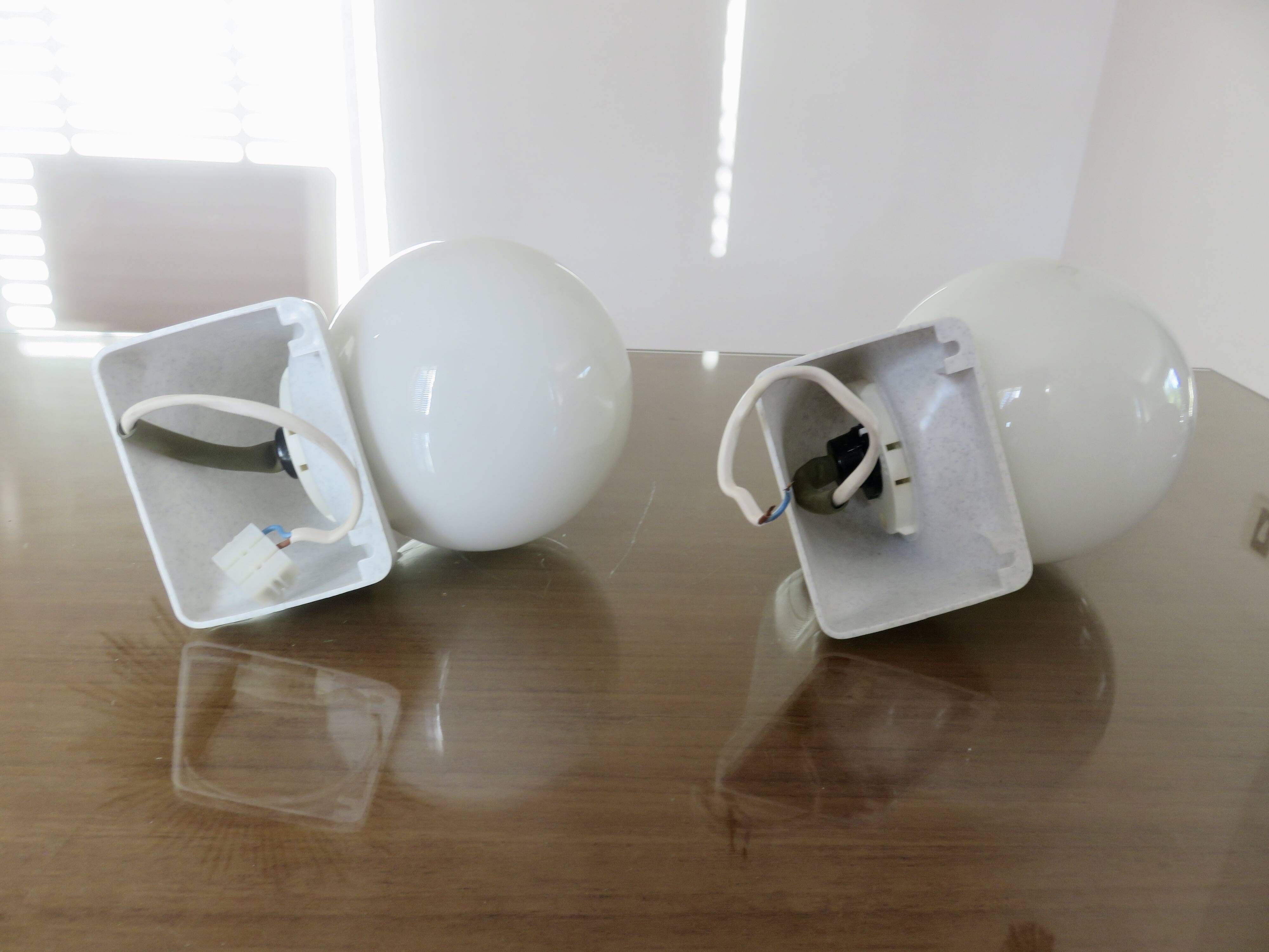 Pair of streamline opaline wall lights from the 80s