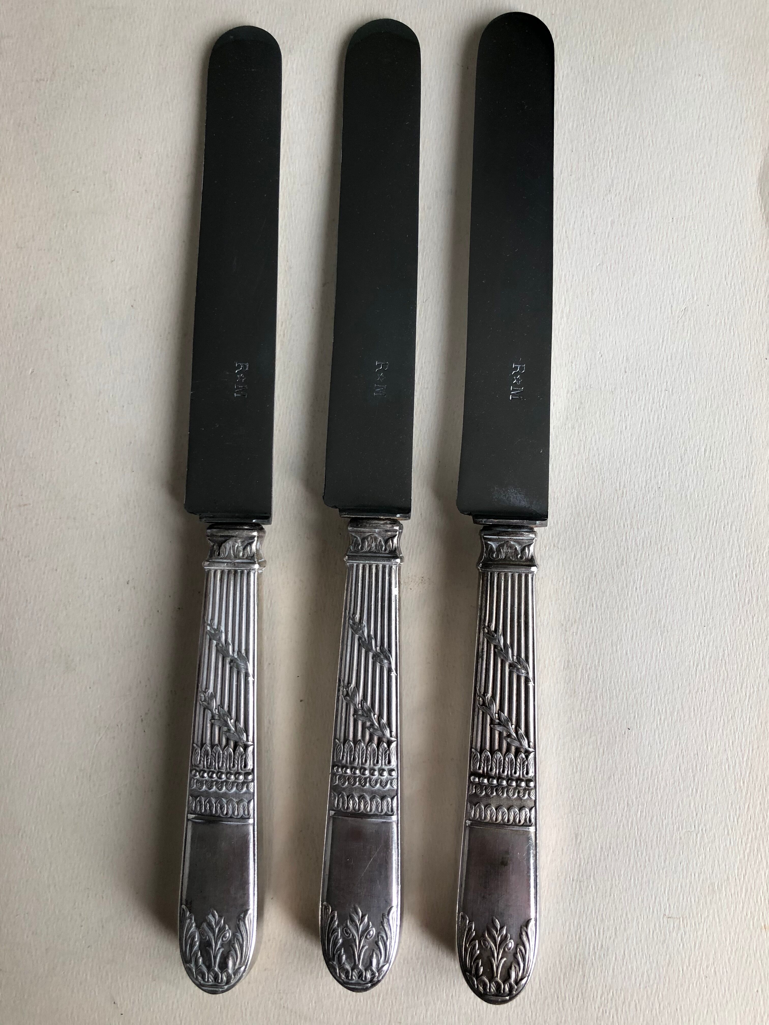 Set of 12 silver metal knives