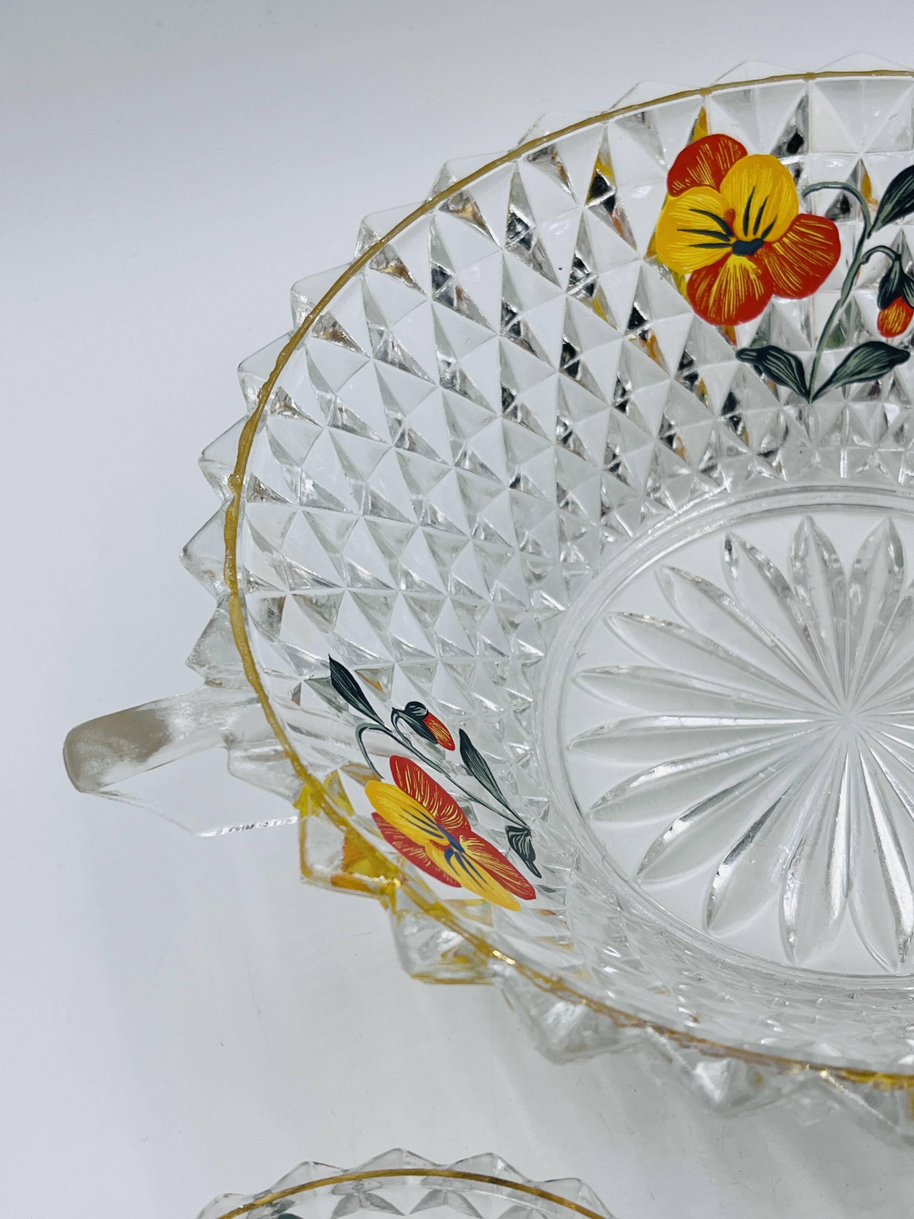 Vintage glass fruit salad serving set with a pansy design.