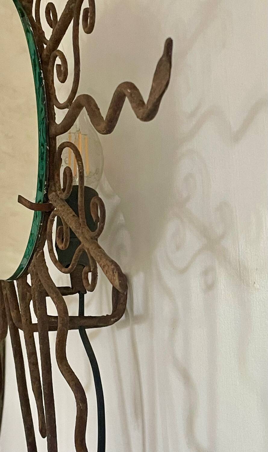 Luminous wrought iron sun mirror