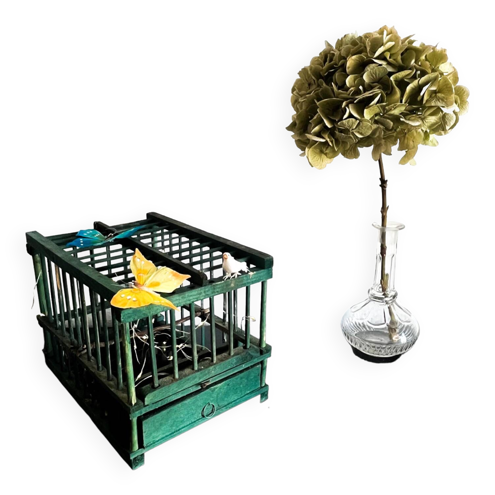 old bird cage made of wood and painted green