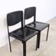 Pair of Matteo Grassi chairs in black saddle leather, 1980s.