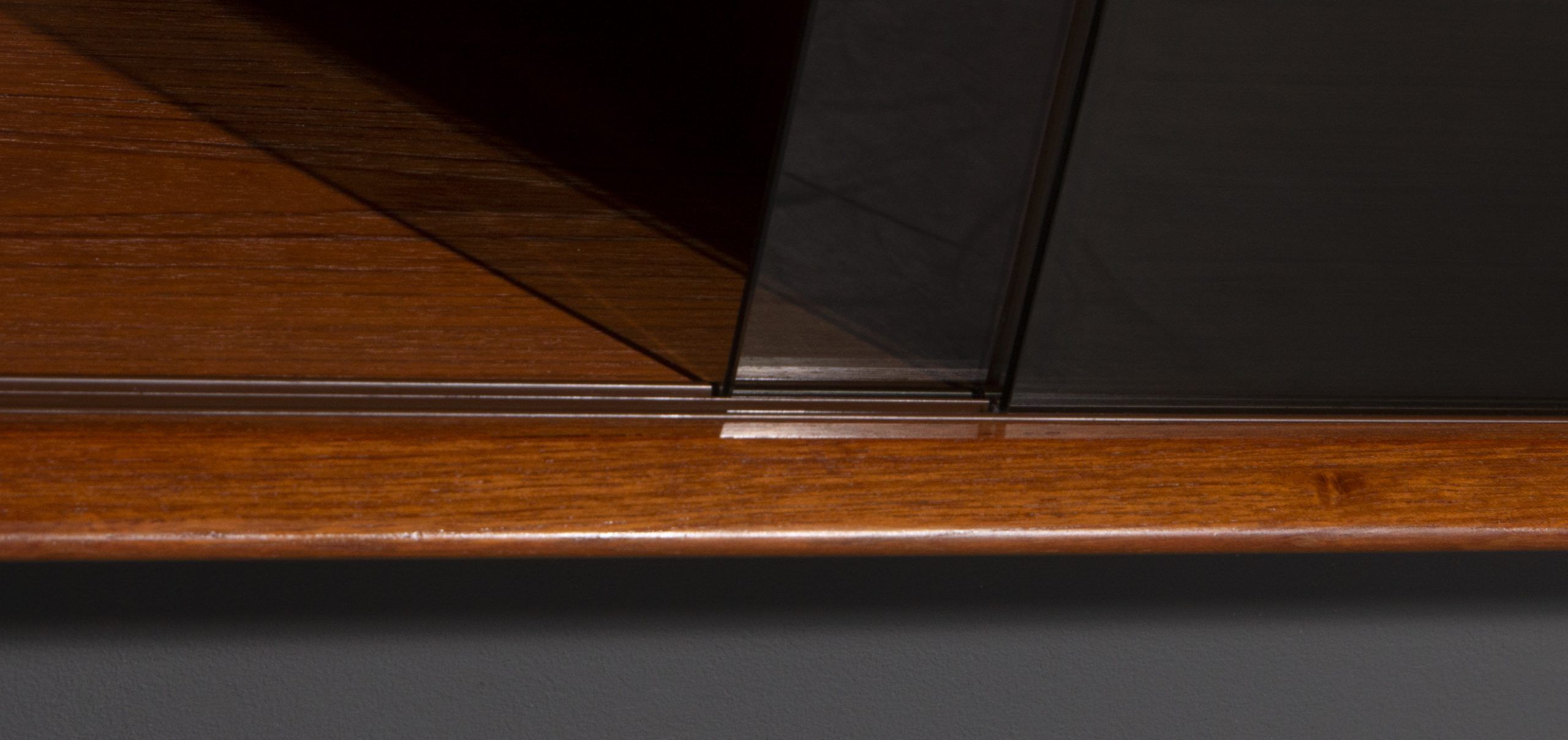 Teak wall cabinet with sliding glass doors