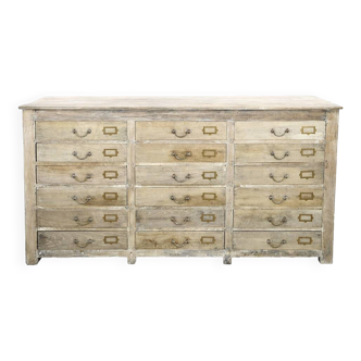 Old wooden sideboard with 18 drawers