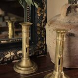 Pair of brass torch candle holders with pushers