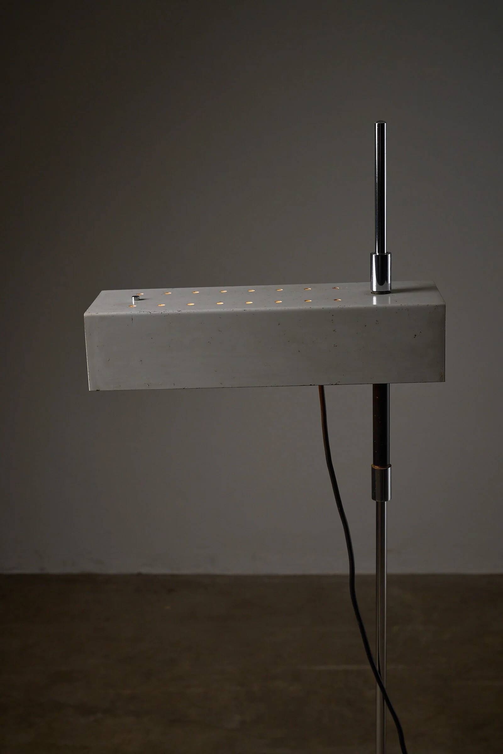 Adjustable perforated shade floor lamp