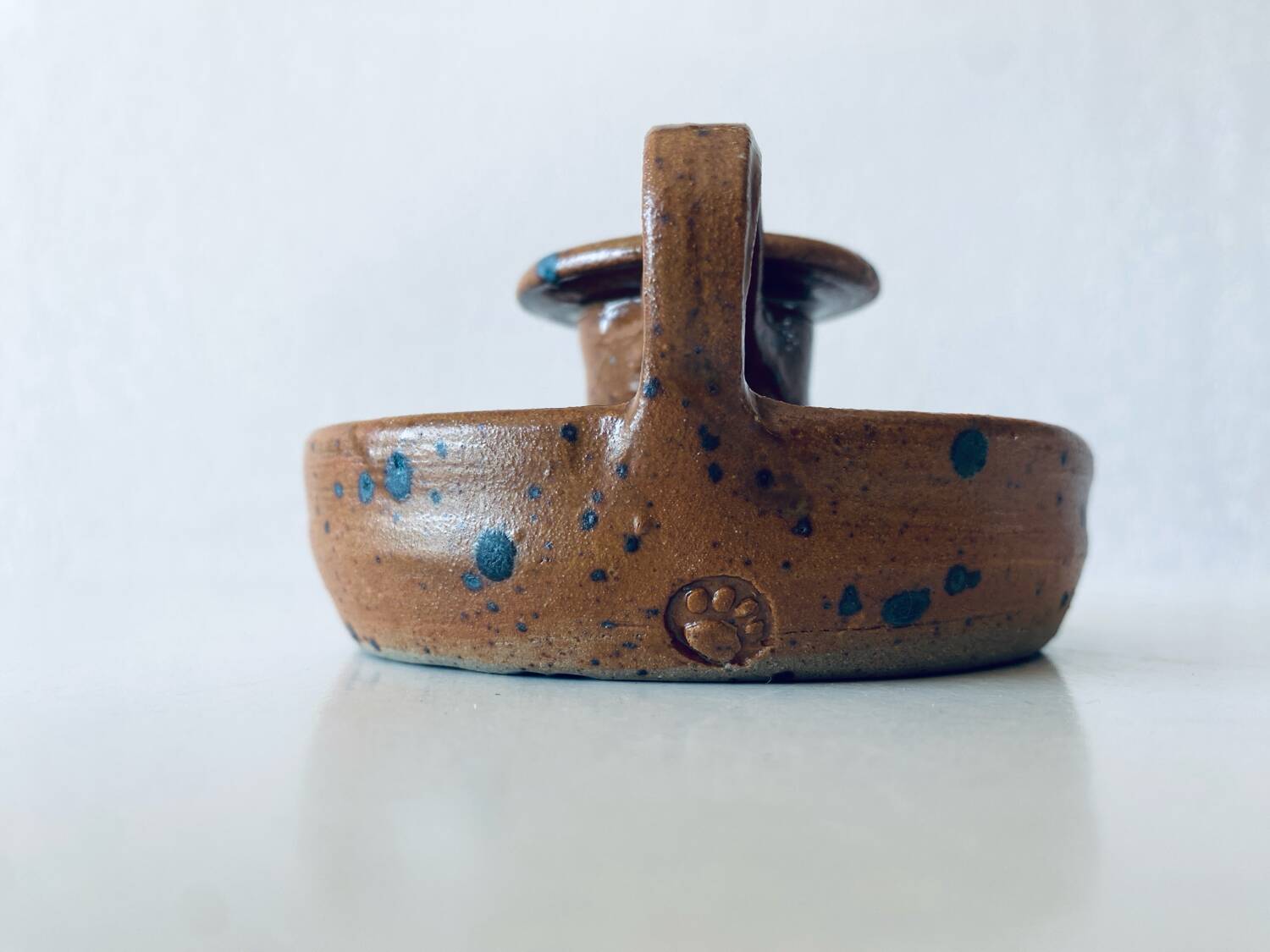 Signed sandstone candle holder