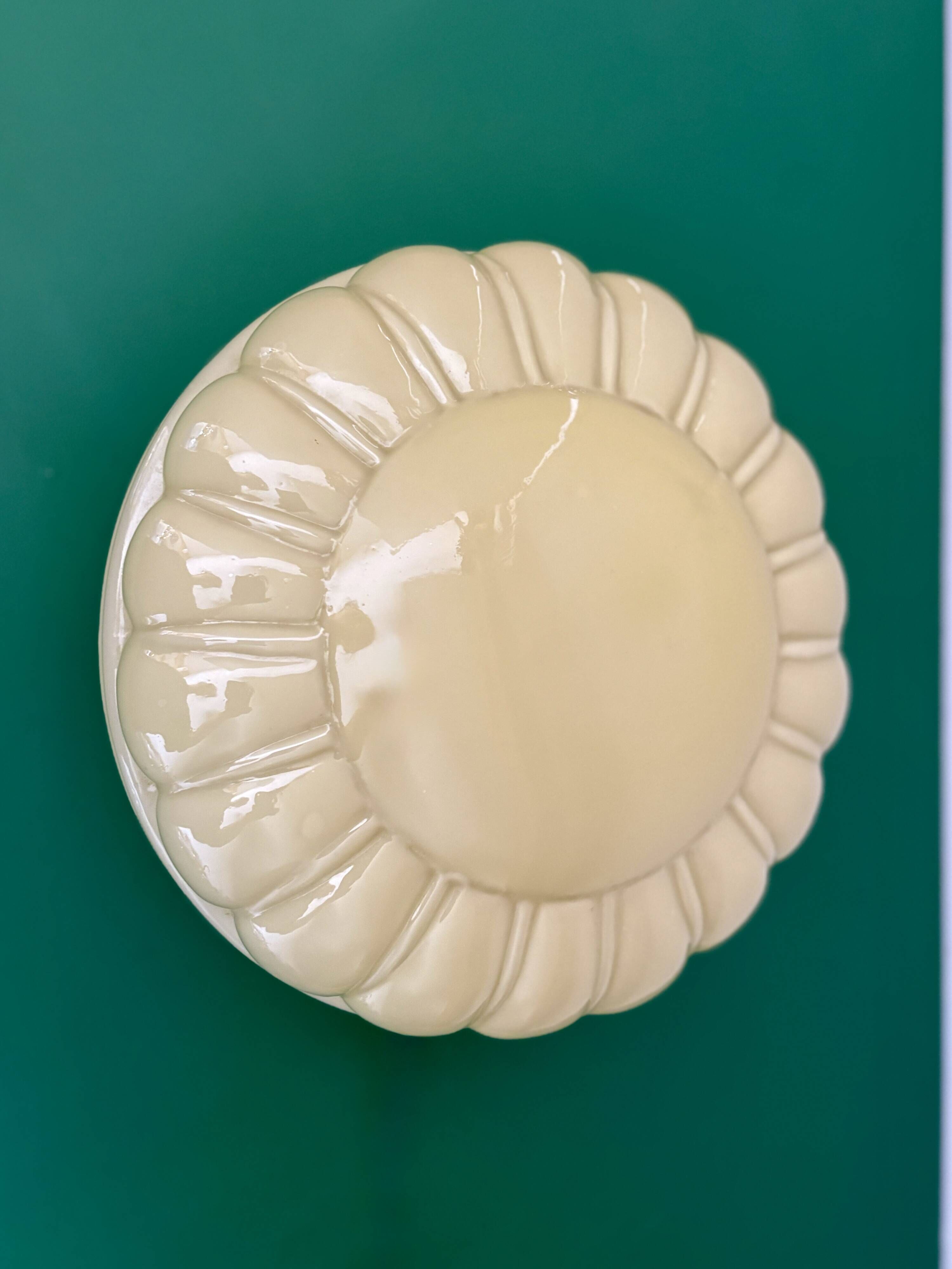 Vintage Art Deco globe wall or ceiling light in yellow opaline.