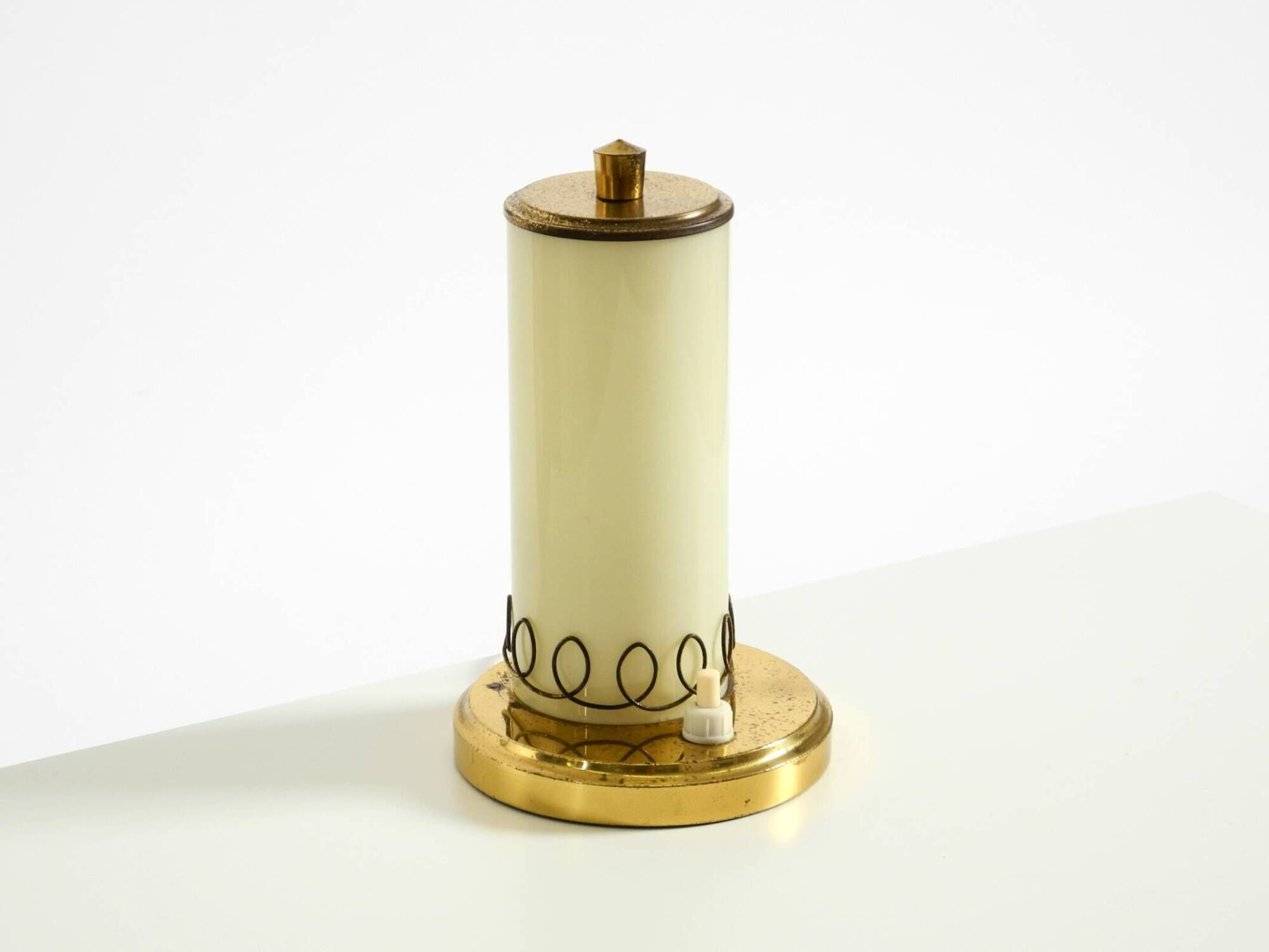 A beautiful, rare 1950s brass table lamp with one opal glass shade adorned