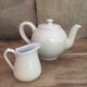 Teapot and vintage milk jar