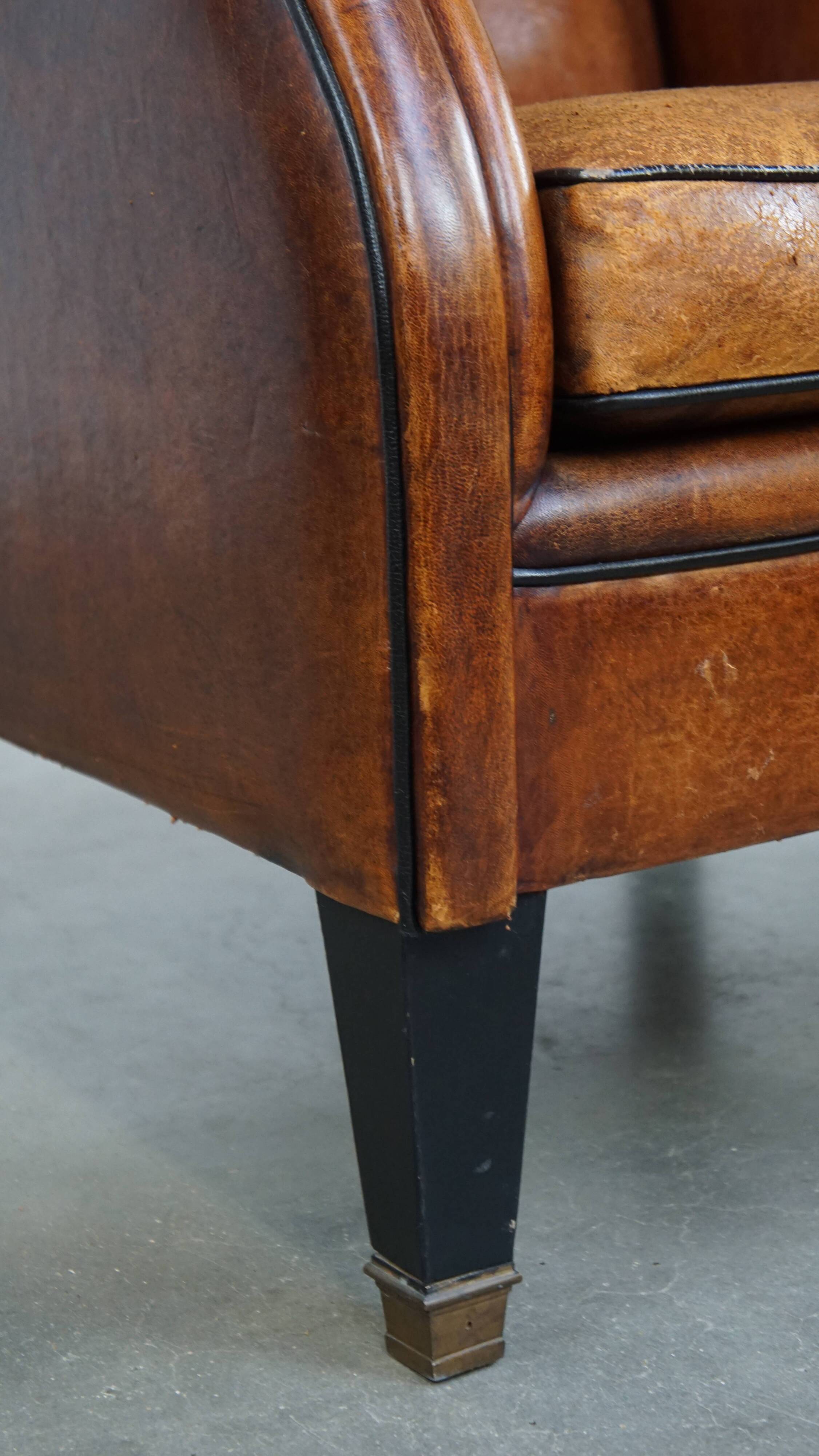Fauteuil à oreilles en cuir de mouton vintage de style anglais