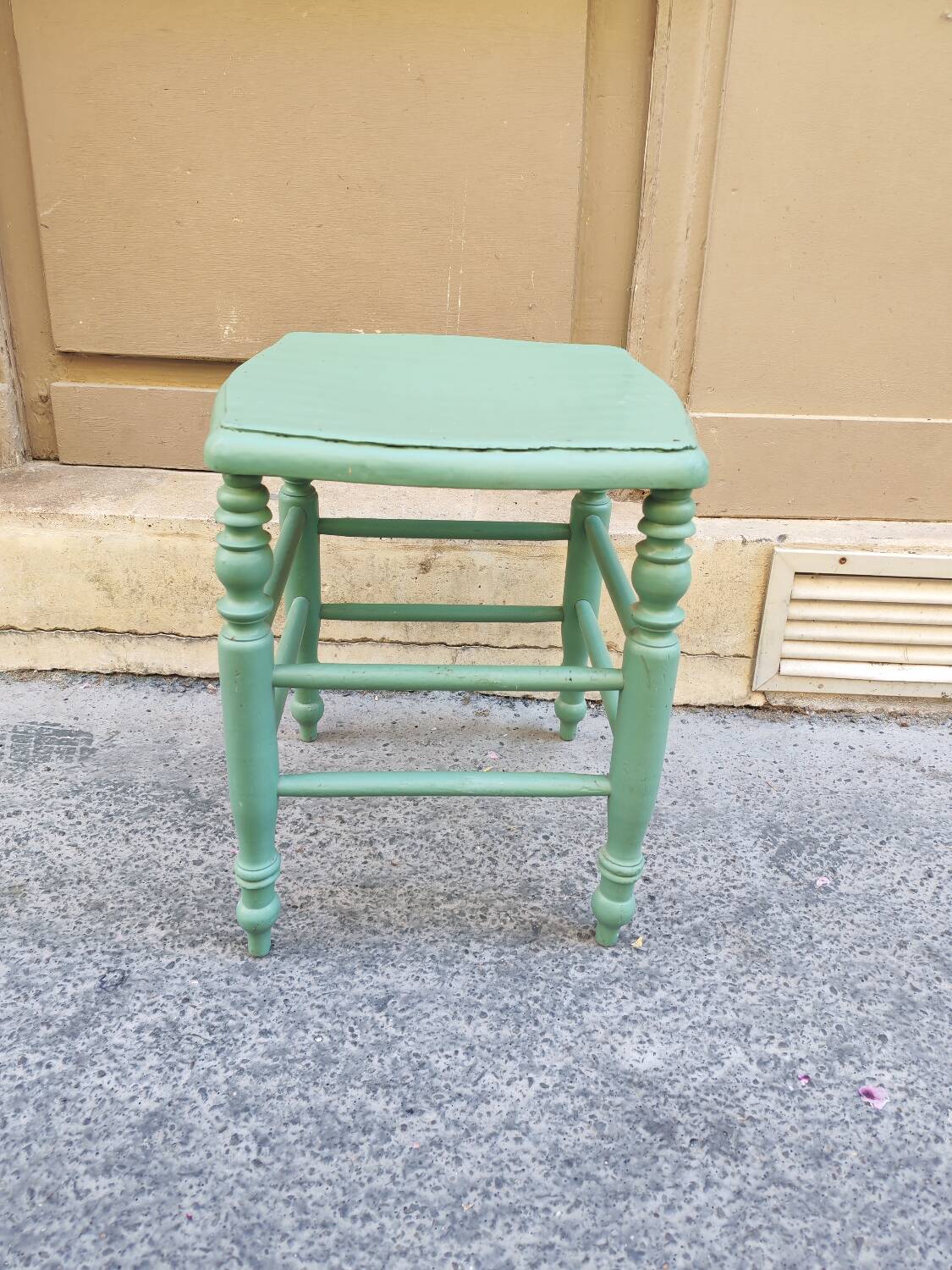Antique green stool