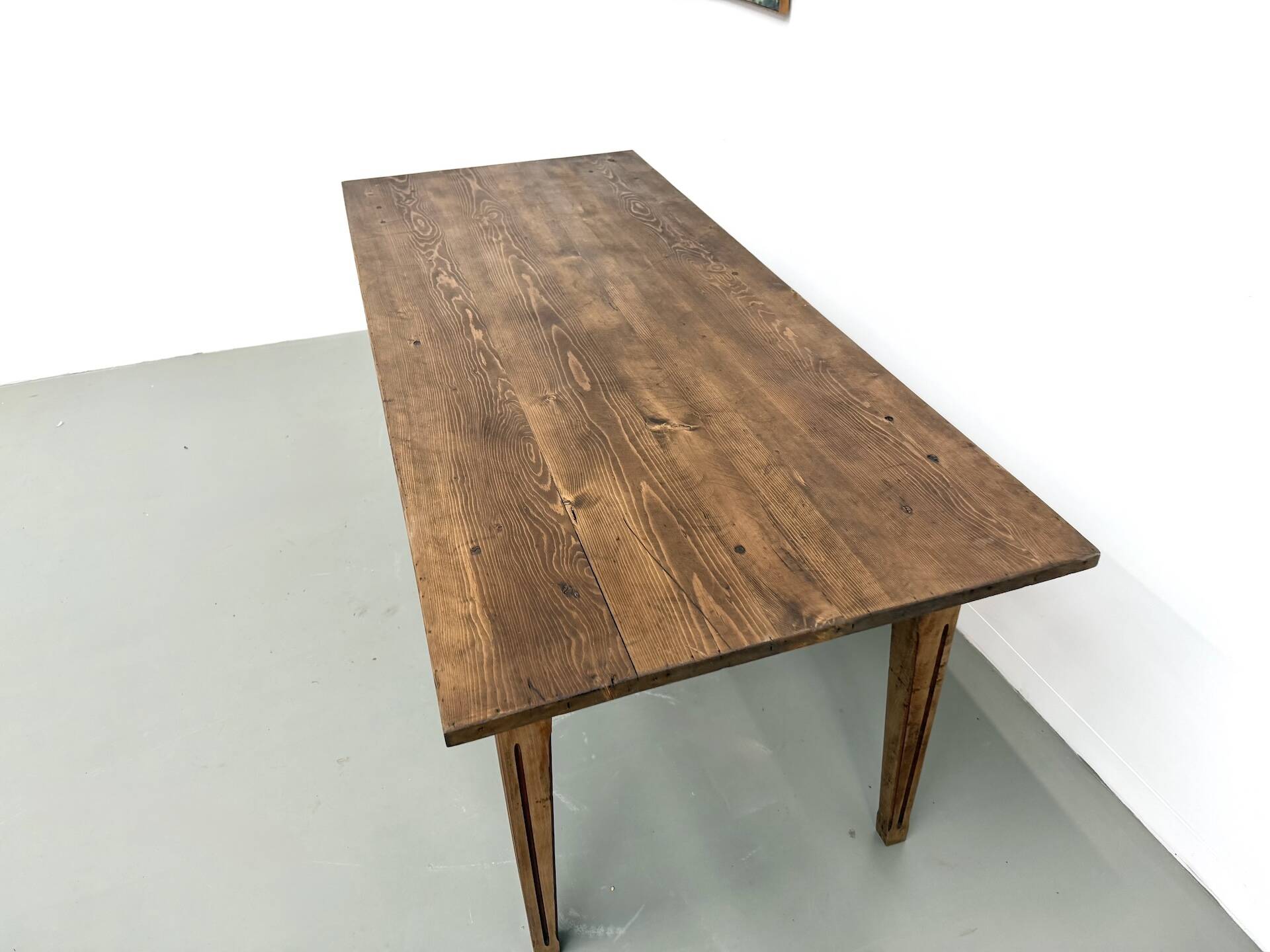 Solid pine farmhouse table, two drawers, fluted legs, France.