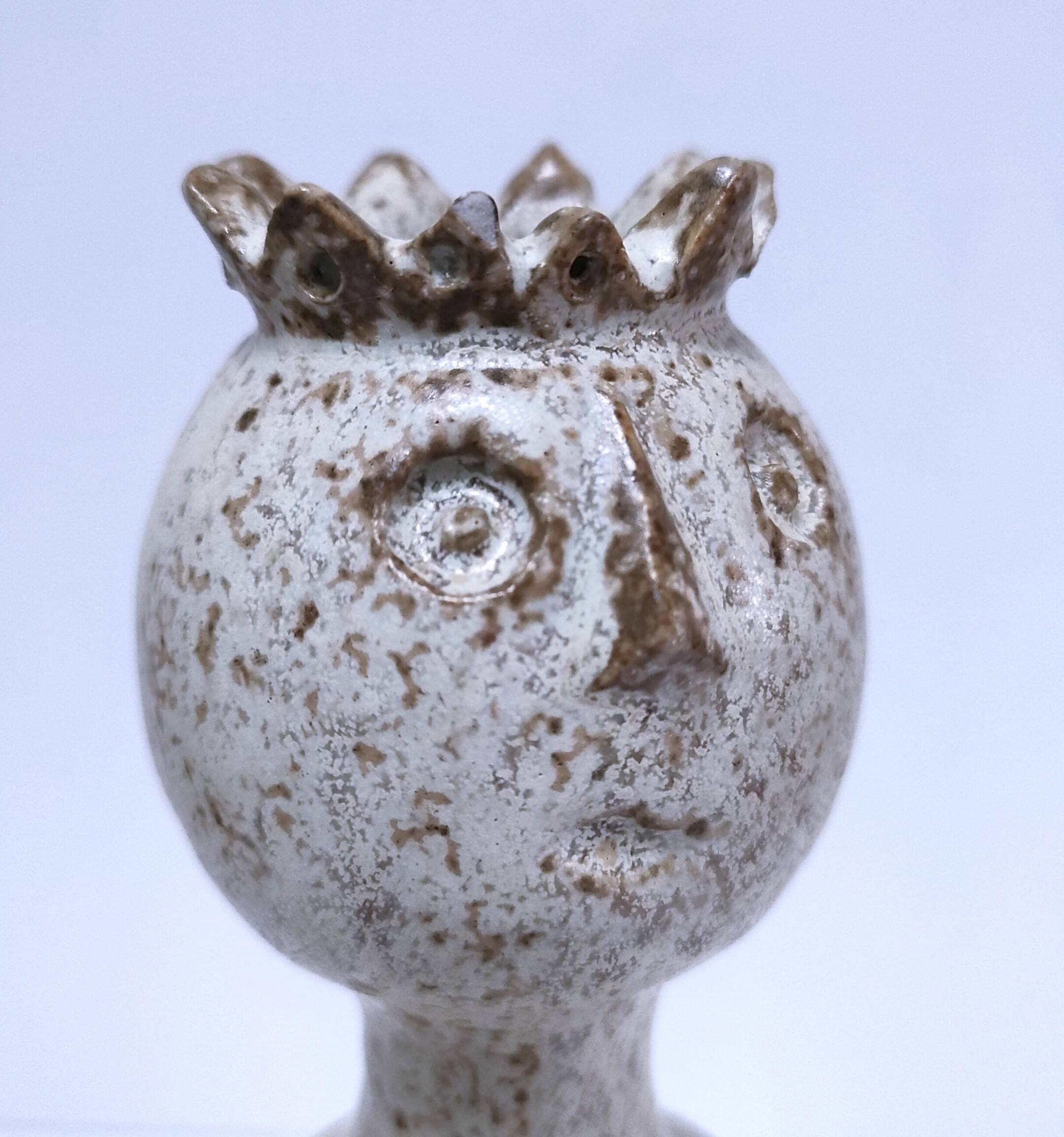 ceramic candle holder with crowned head signed P