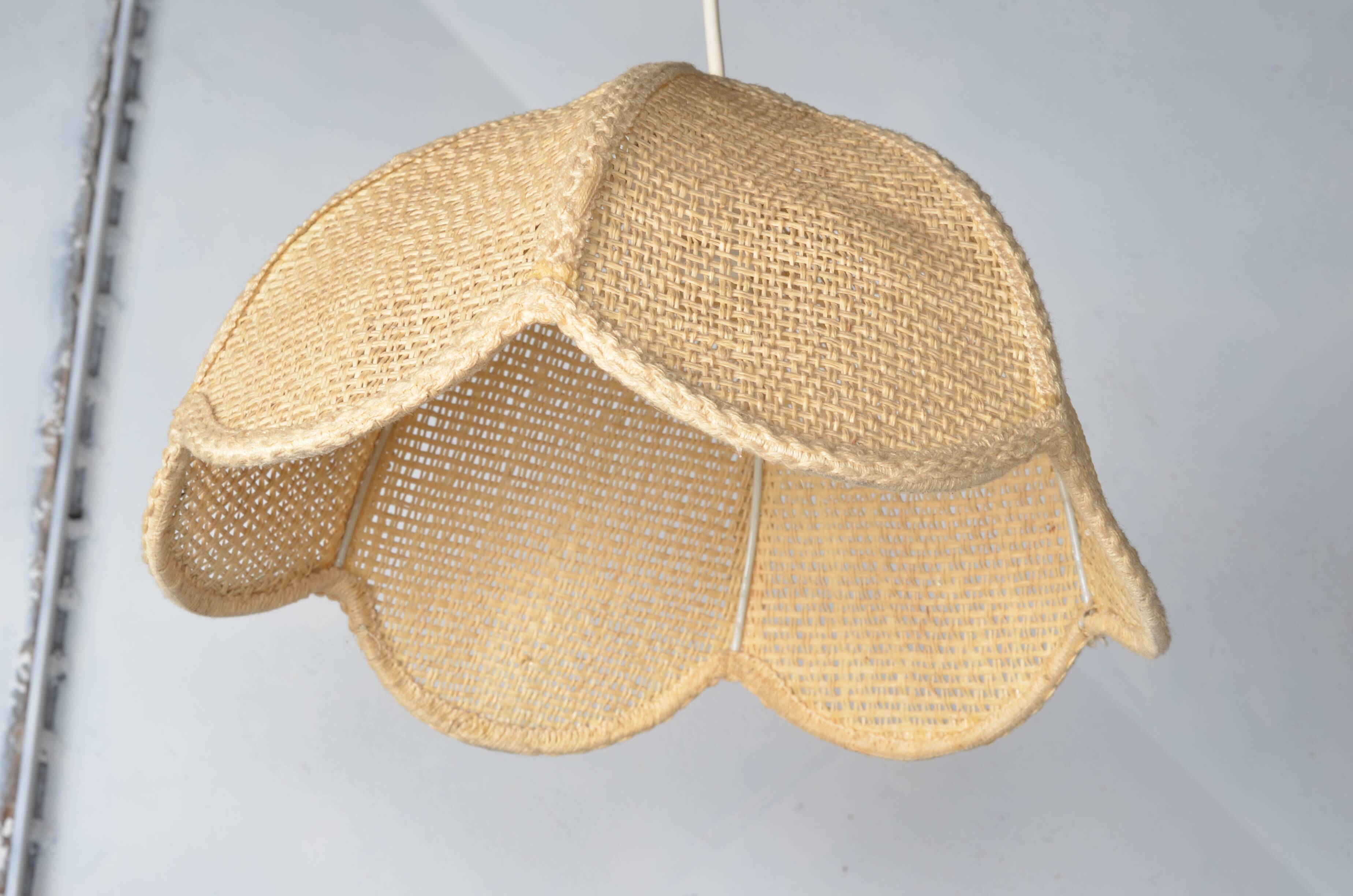 Braided flower pendant