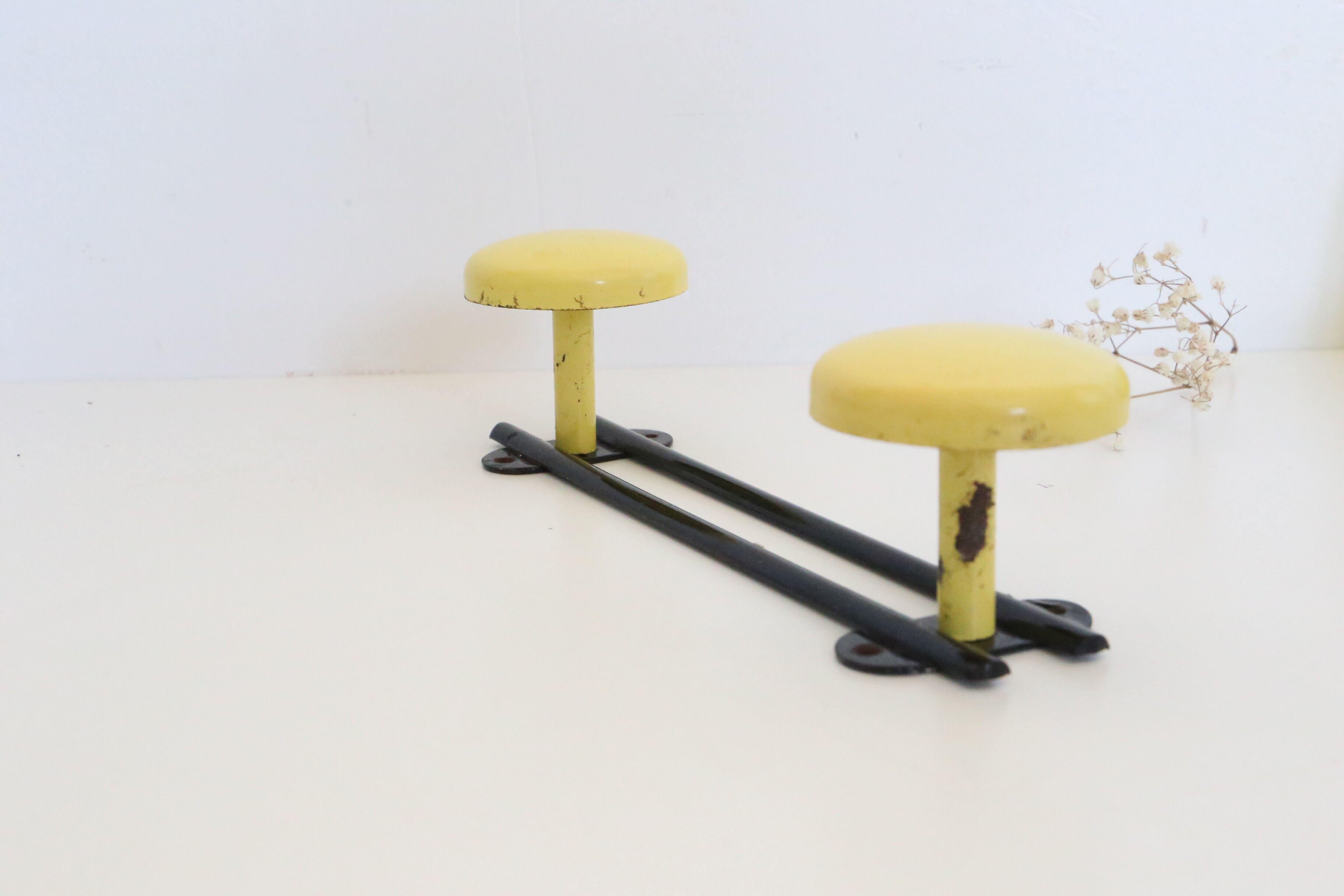 Wall coat rack in yellow and black metal, vintage