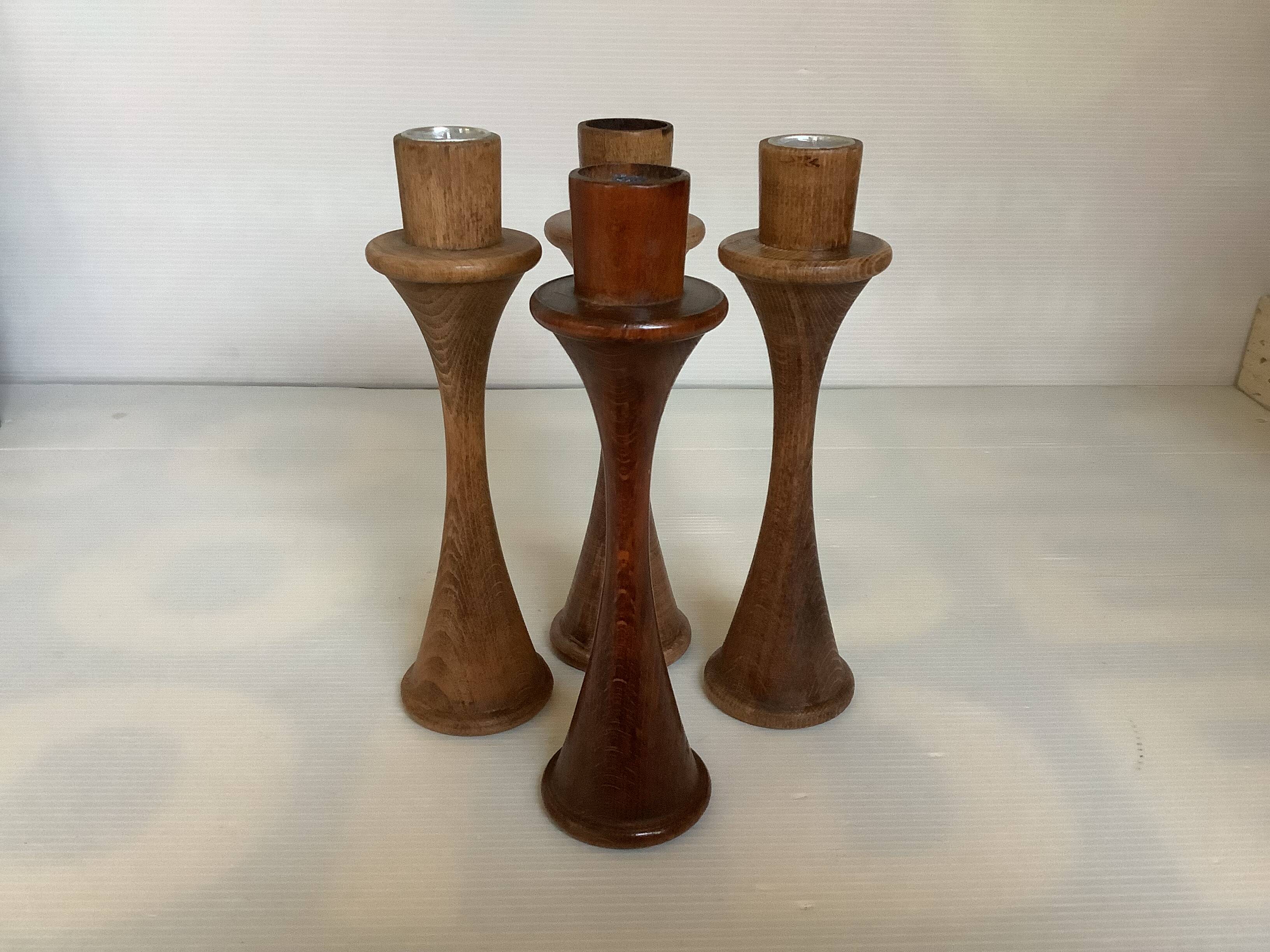 Four Scandinavian-style wooden candle holders