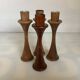Four Scandinavian-style wooden candle holders