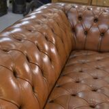 Fawn-colored tufted Chesterfield sofa