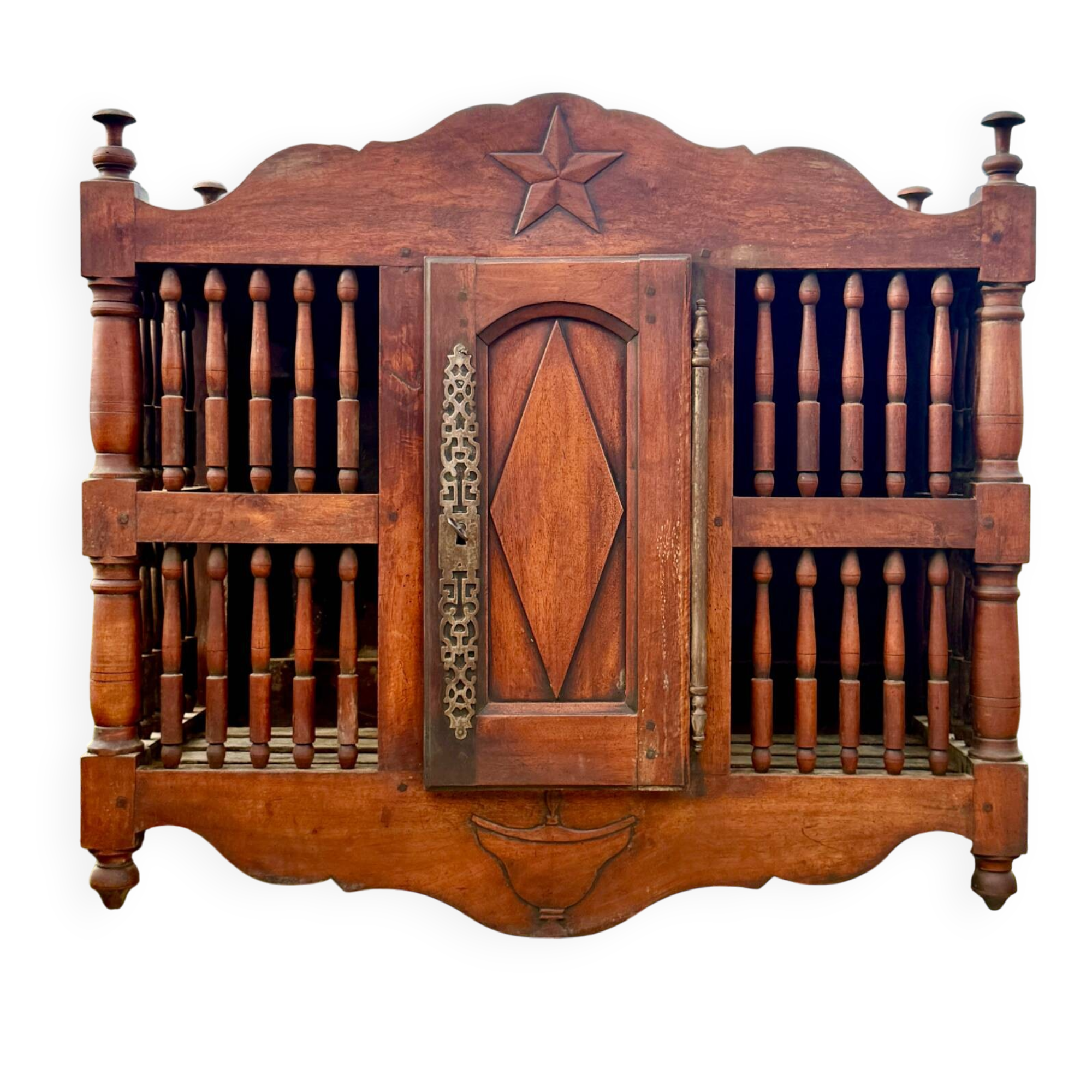 Molded and carved walnut panetière, 19th century.