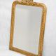 Louis-Philippe mirror from the 19th century with a ribbon trompe-l'œil frame.