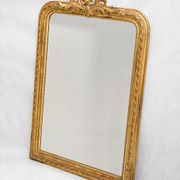 Louis-Philippe mirror from the 19th century with a ribbon trompe-l'œil frame.