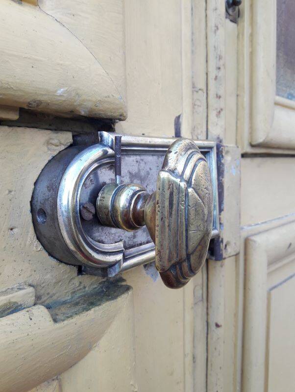 19th century double arched entrance door in oak with grilles and old glass