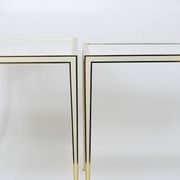 A pair of brass and white mirror tables from Vereinigte Werkstätten, Germany, 1970s.