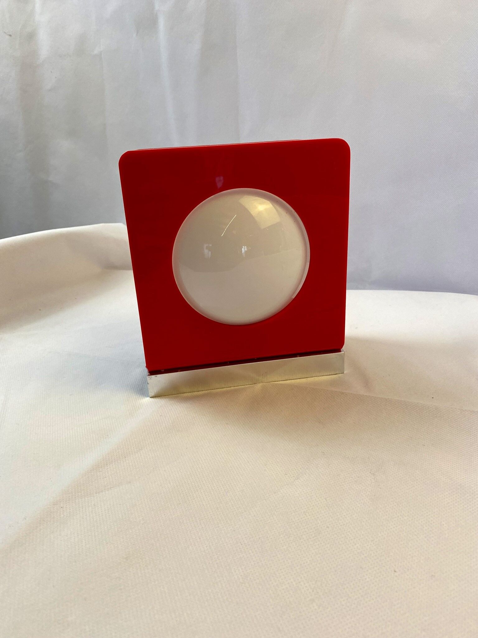 Wall lamp from the 60s in red plastic with white globe