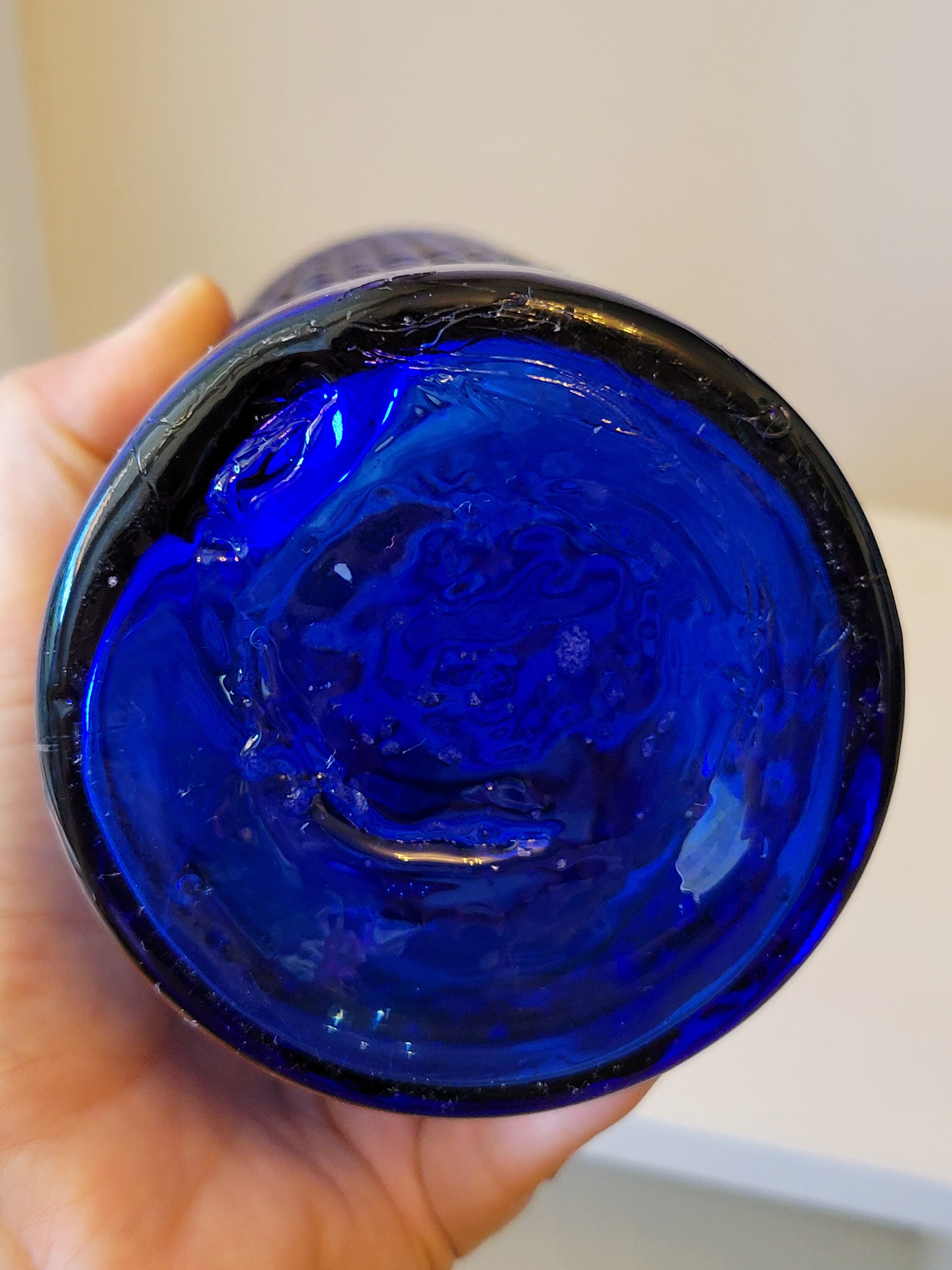 Vintage decanter bottle made of blue molded pressed glass