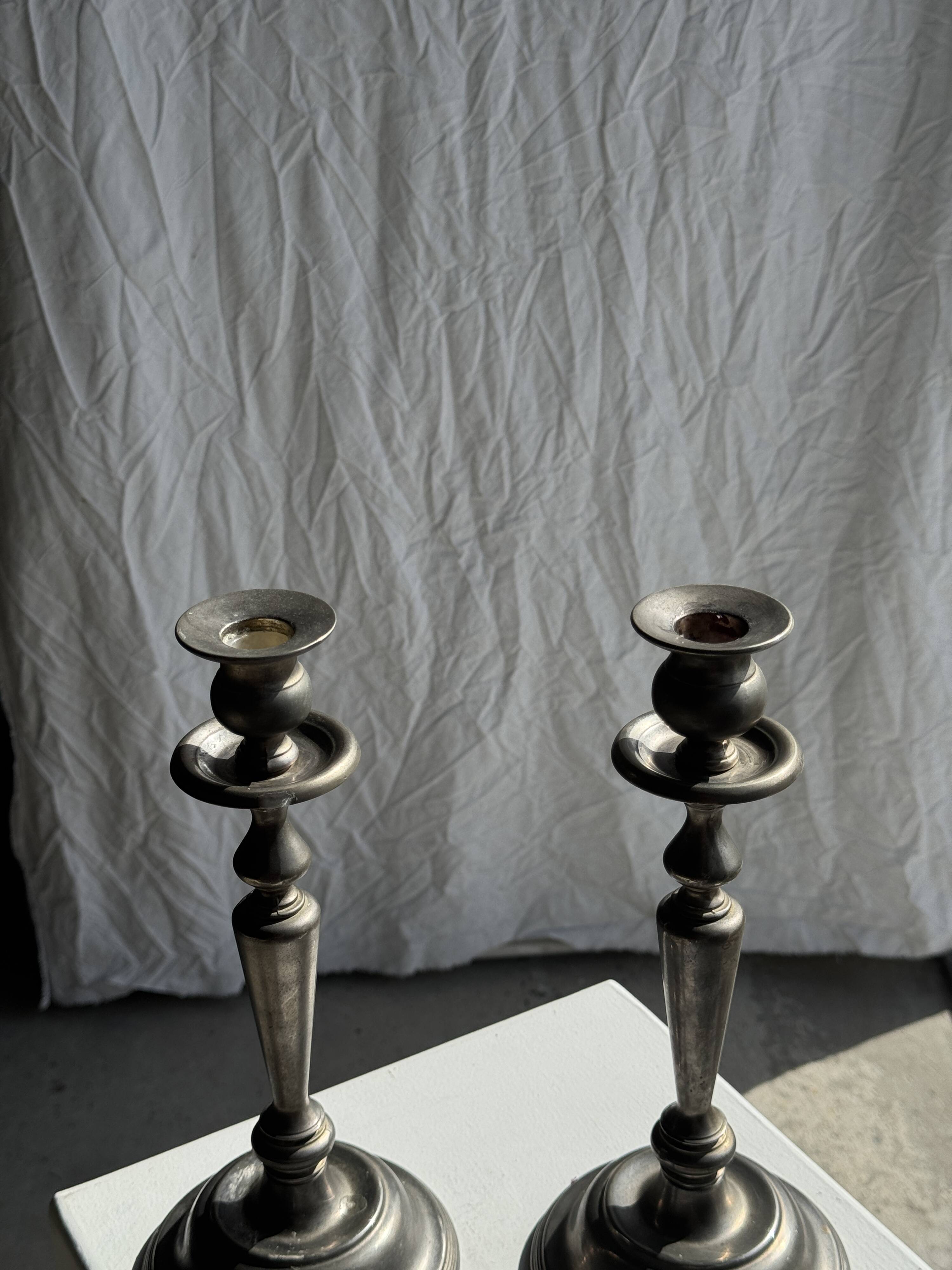 Two large antique silver-plated metal candlesticks, H30