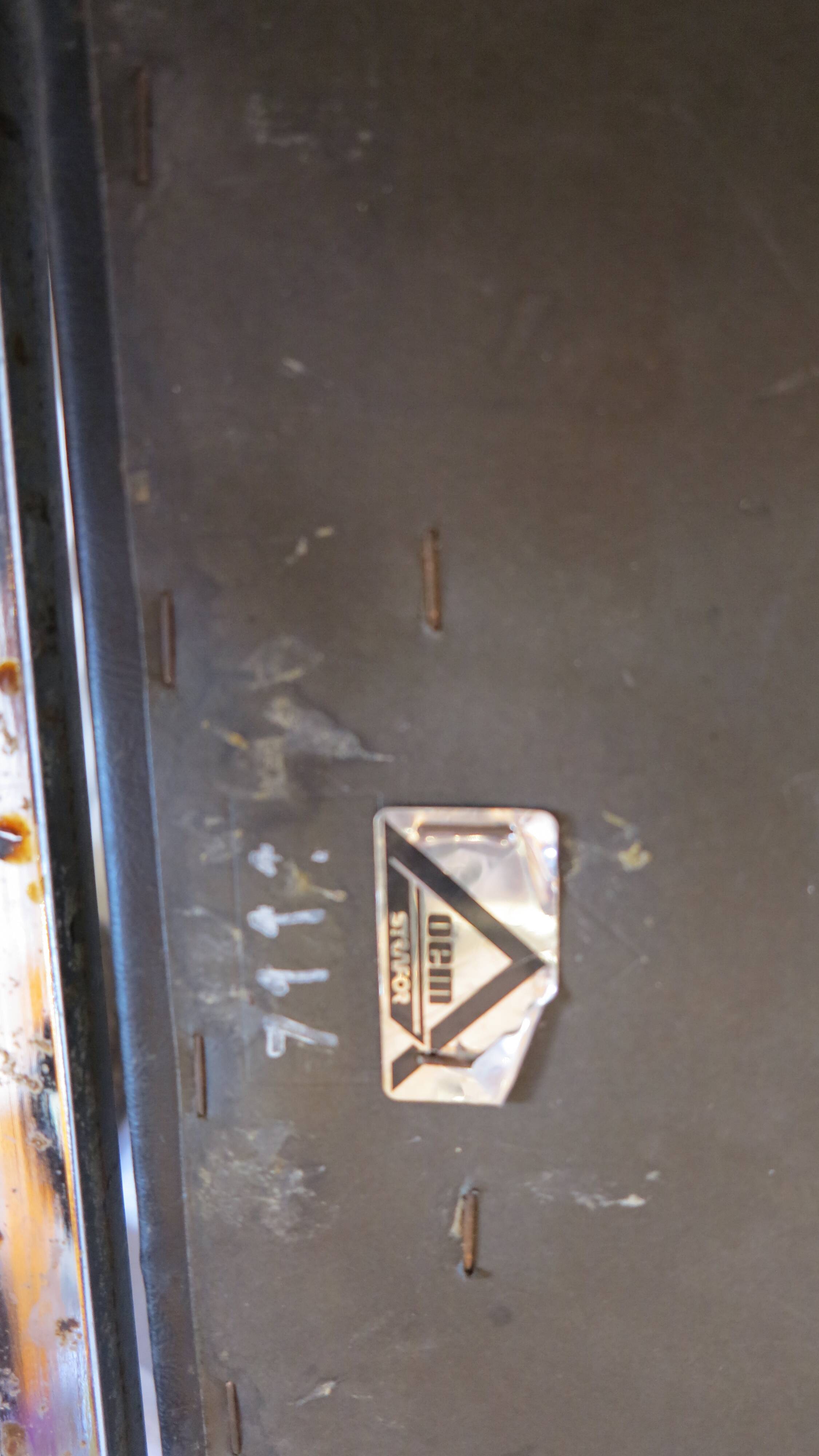 Modernist chair in chromed metal and black imitation leather