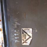 Modernist chair in chromed metal and black imitation leather