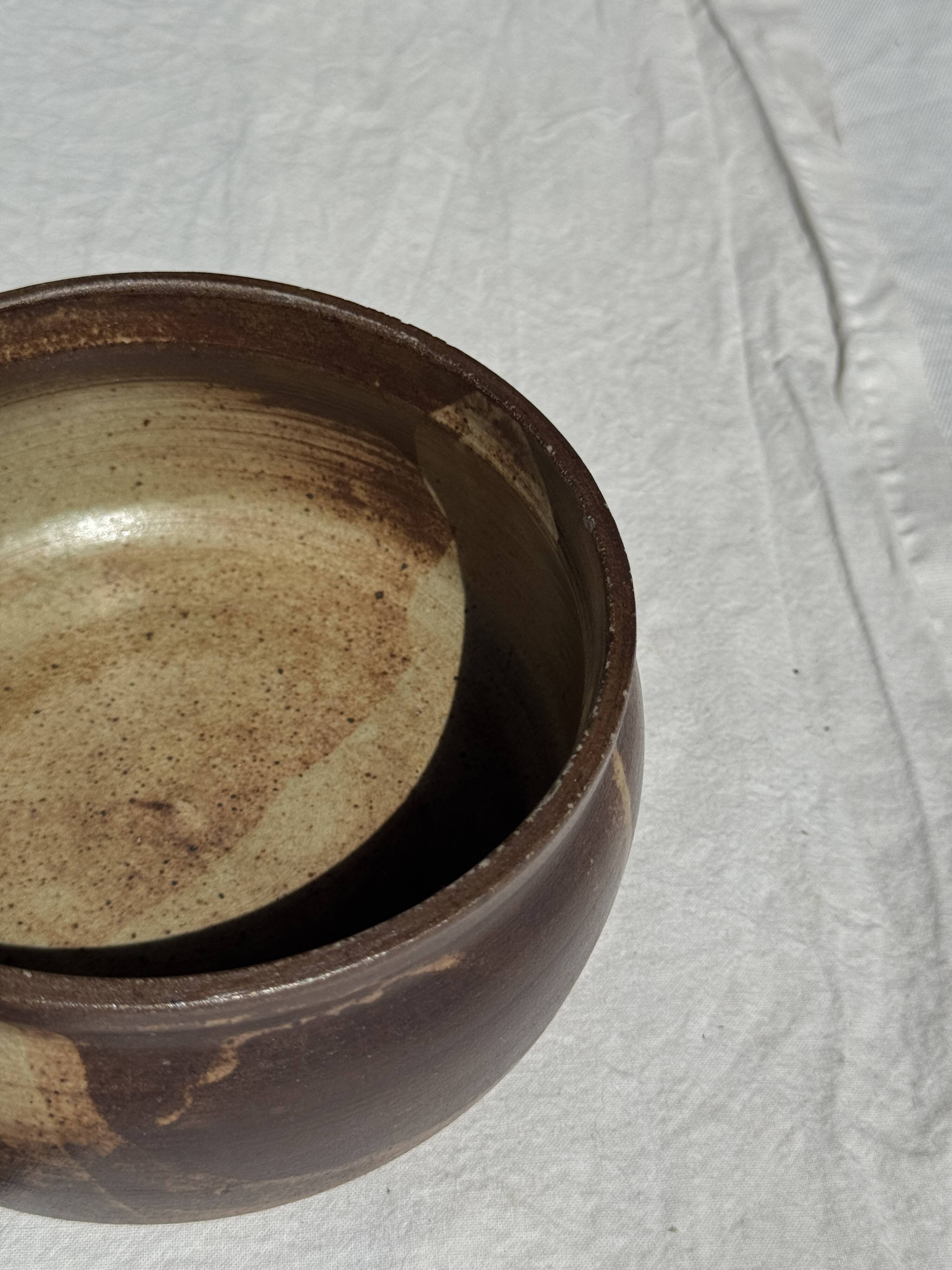 A small stoneware bowl, brown exterior, speckled grey interior D15