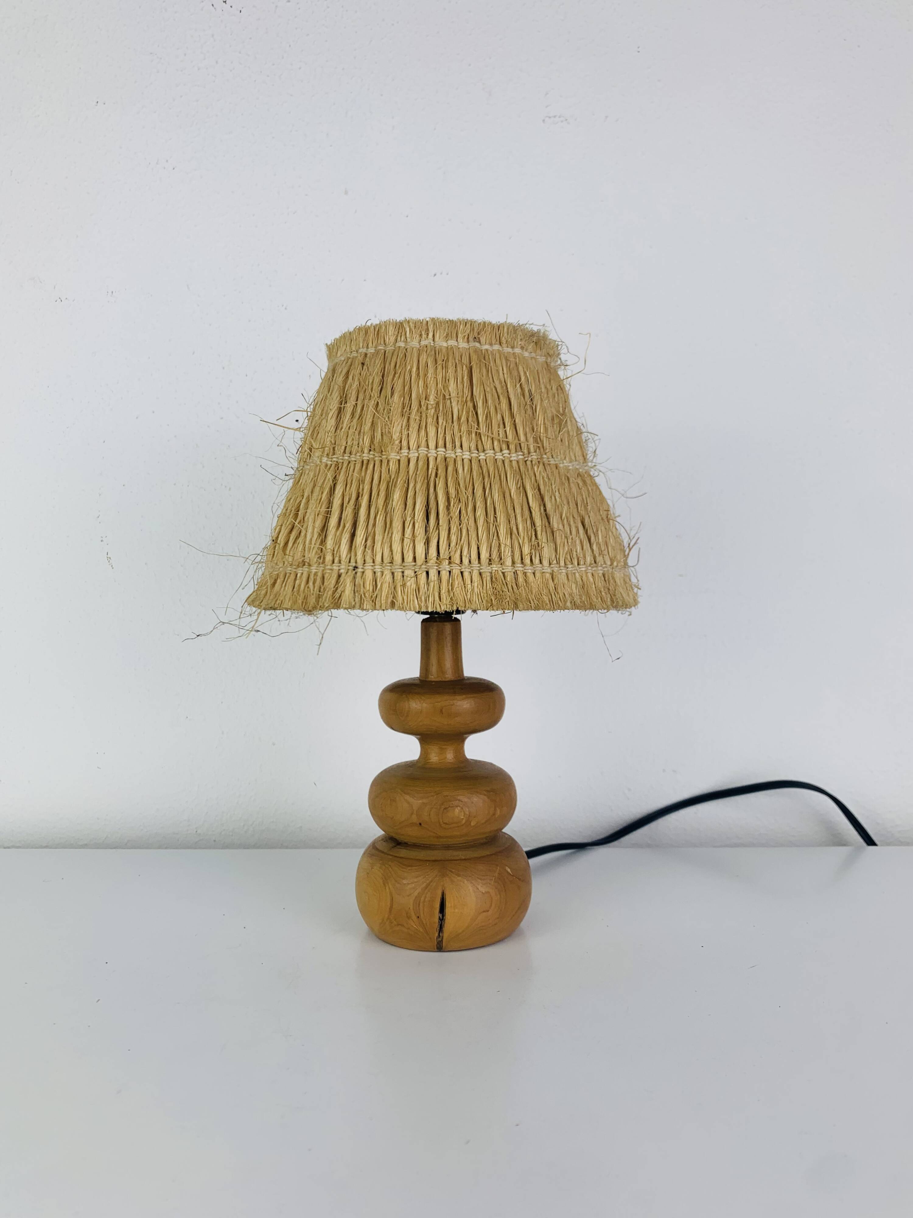 Turned wood lamp with straw shade, 1960s, vintage