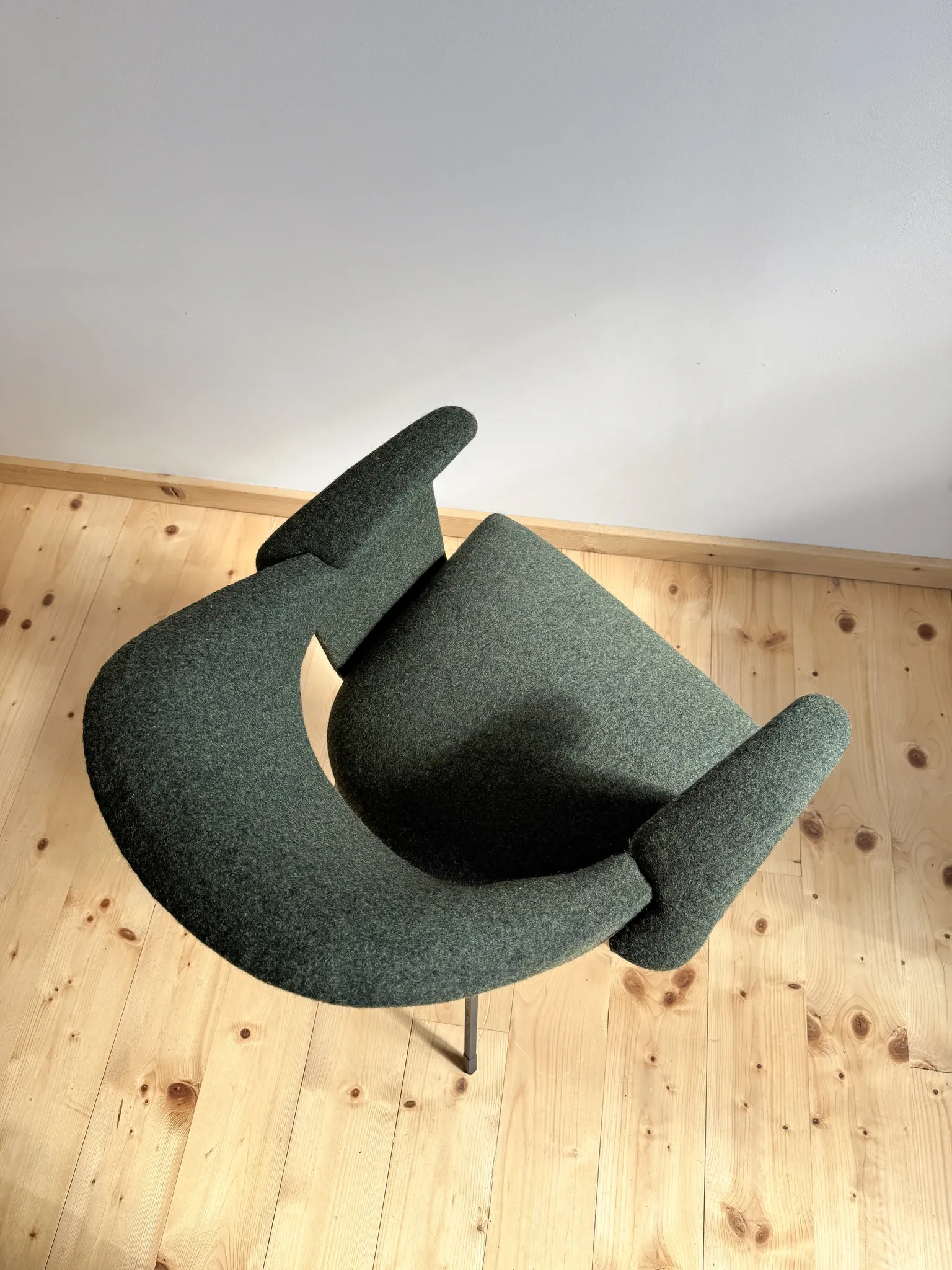 Curved vintage wool armchair from the 1960s