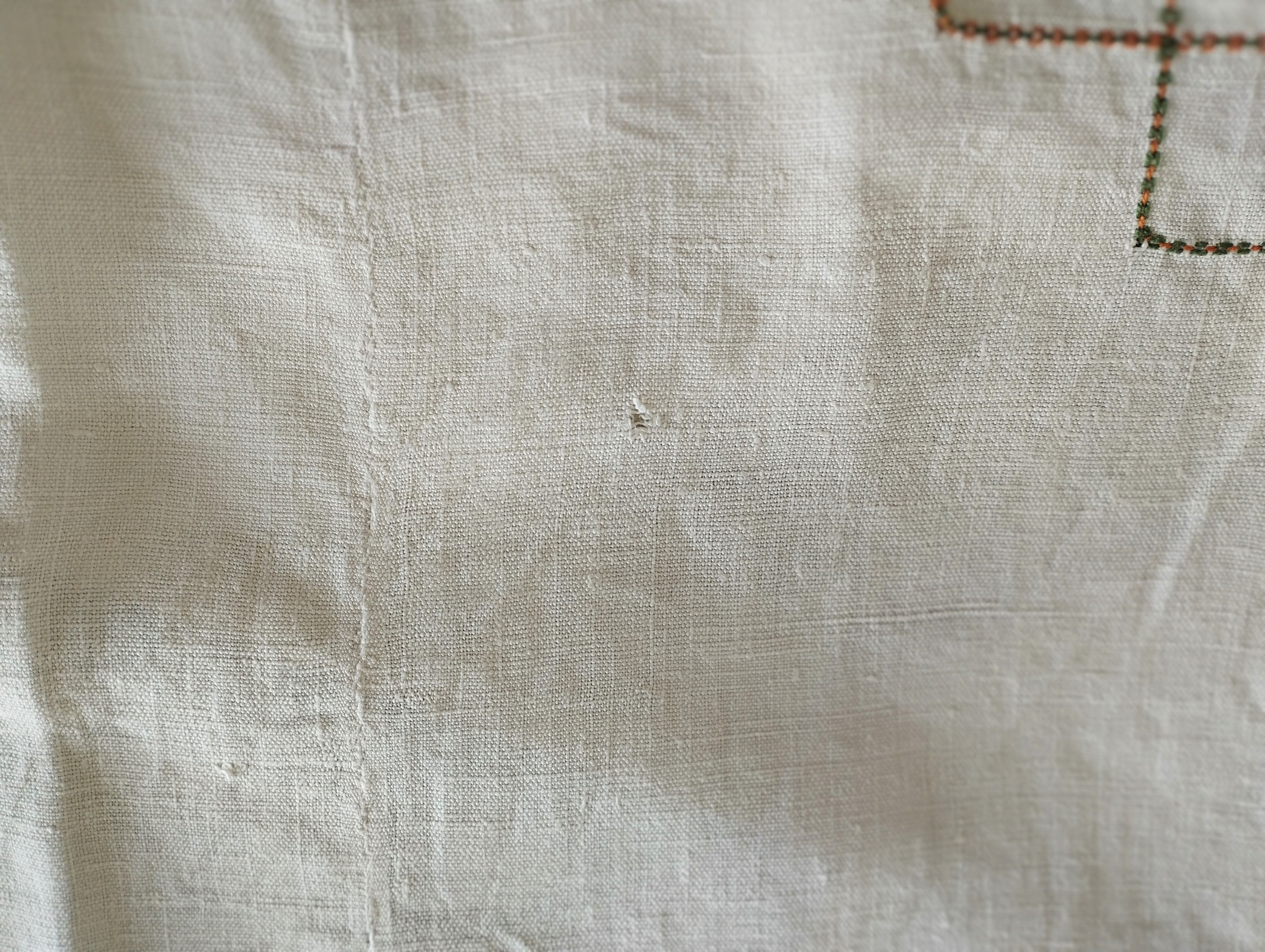 Antique linen tablecloth embroidered with flowers