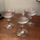 Set of 3 Art Deco engraved champagne glasses with arabesque design.