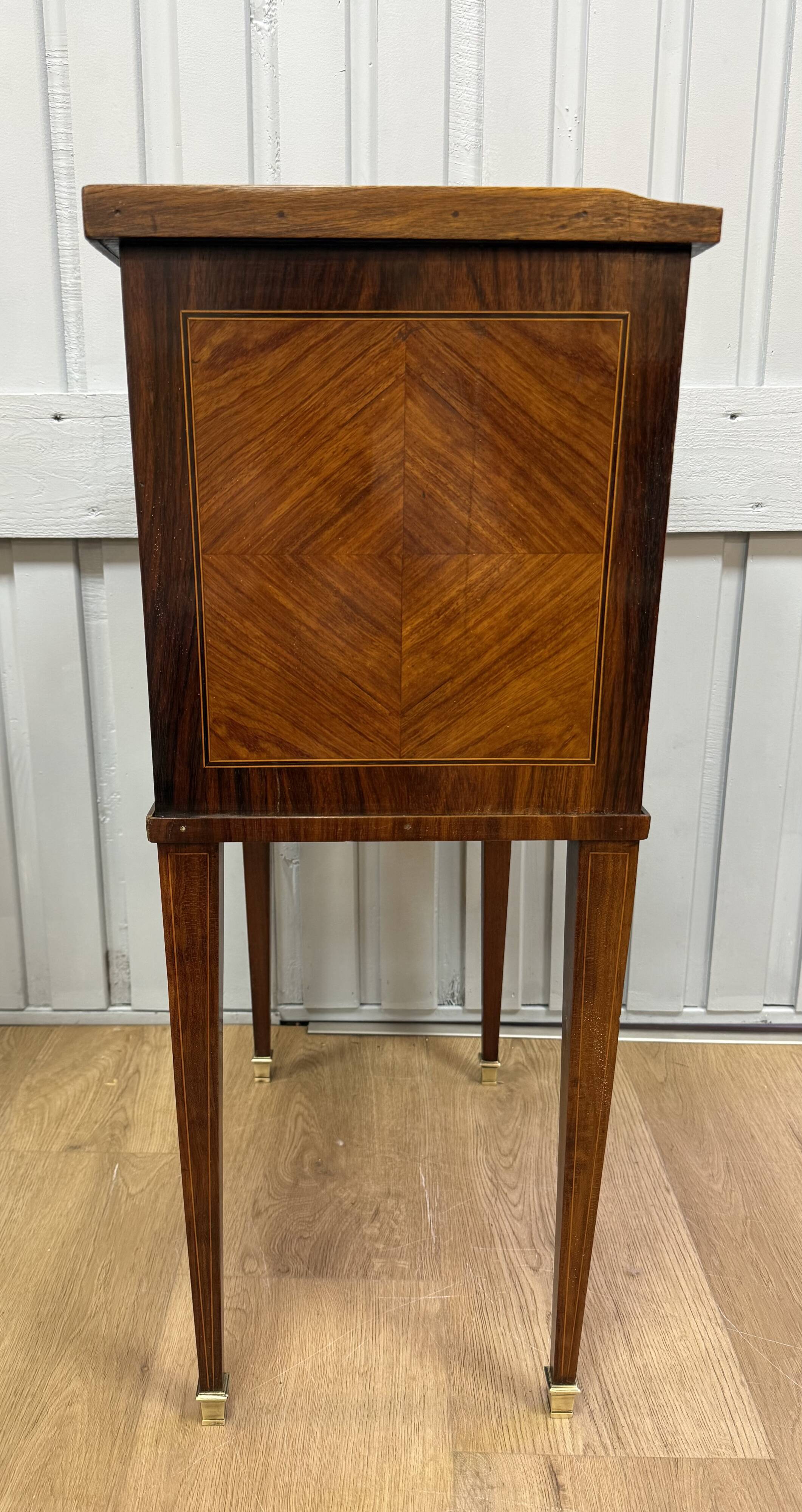 Side table with a faux book front.