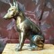Greenhouse book dog sculpture regulates on marble slab