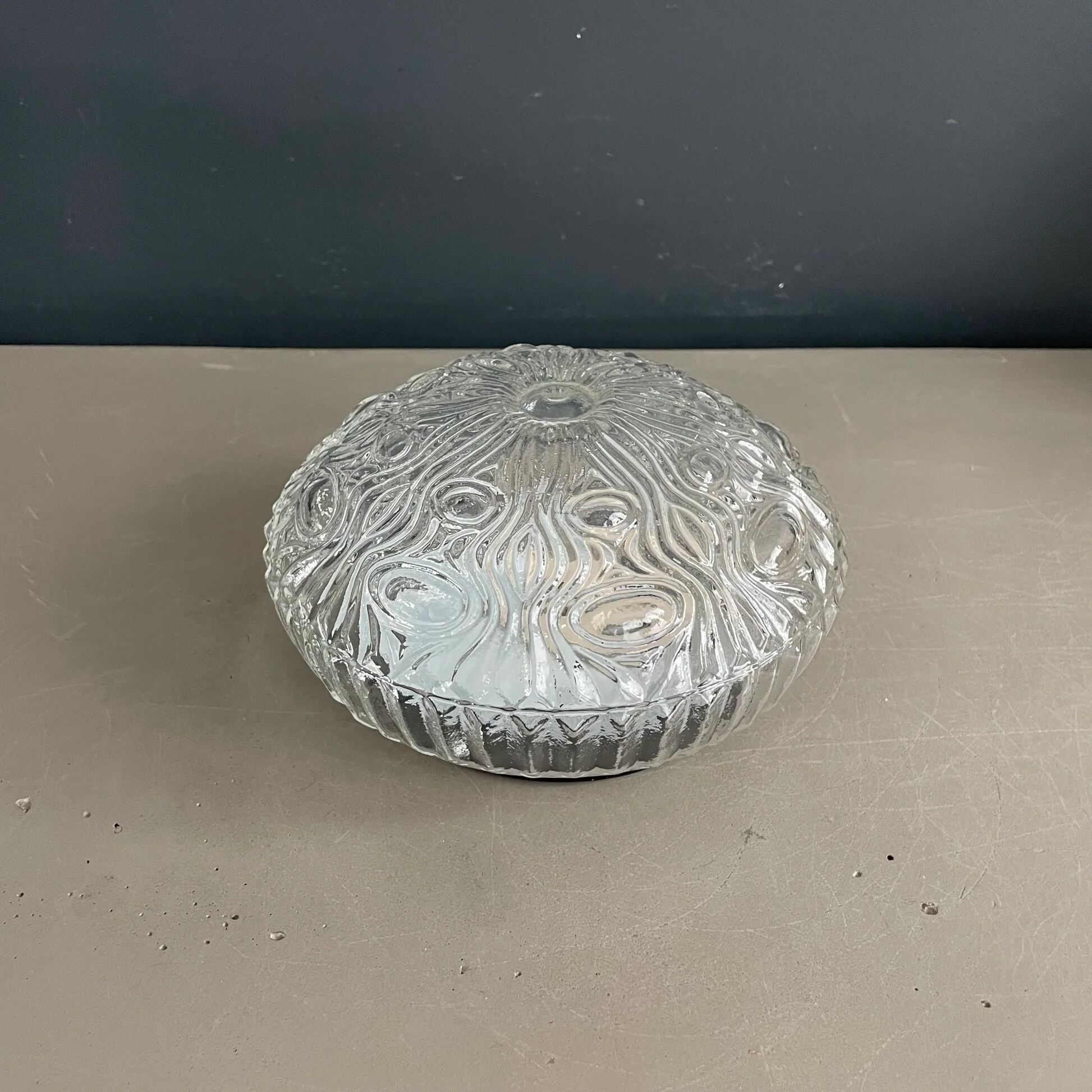 Ceiling light or wall light in moulded convex glass.