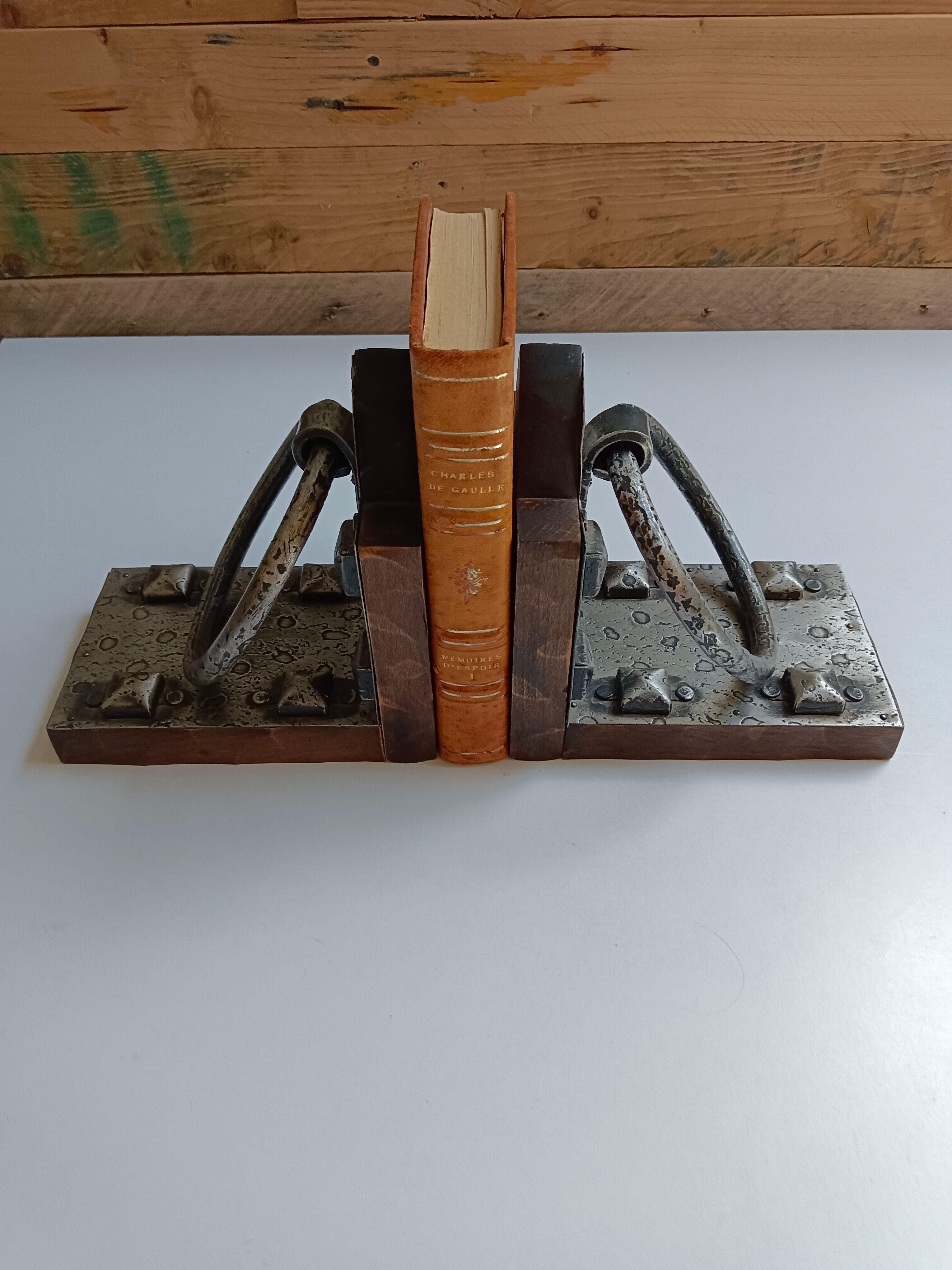Medieval-style bookends, antique door handle.