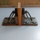 Medieval-style bookends, antique door handle.