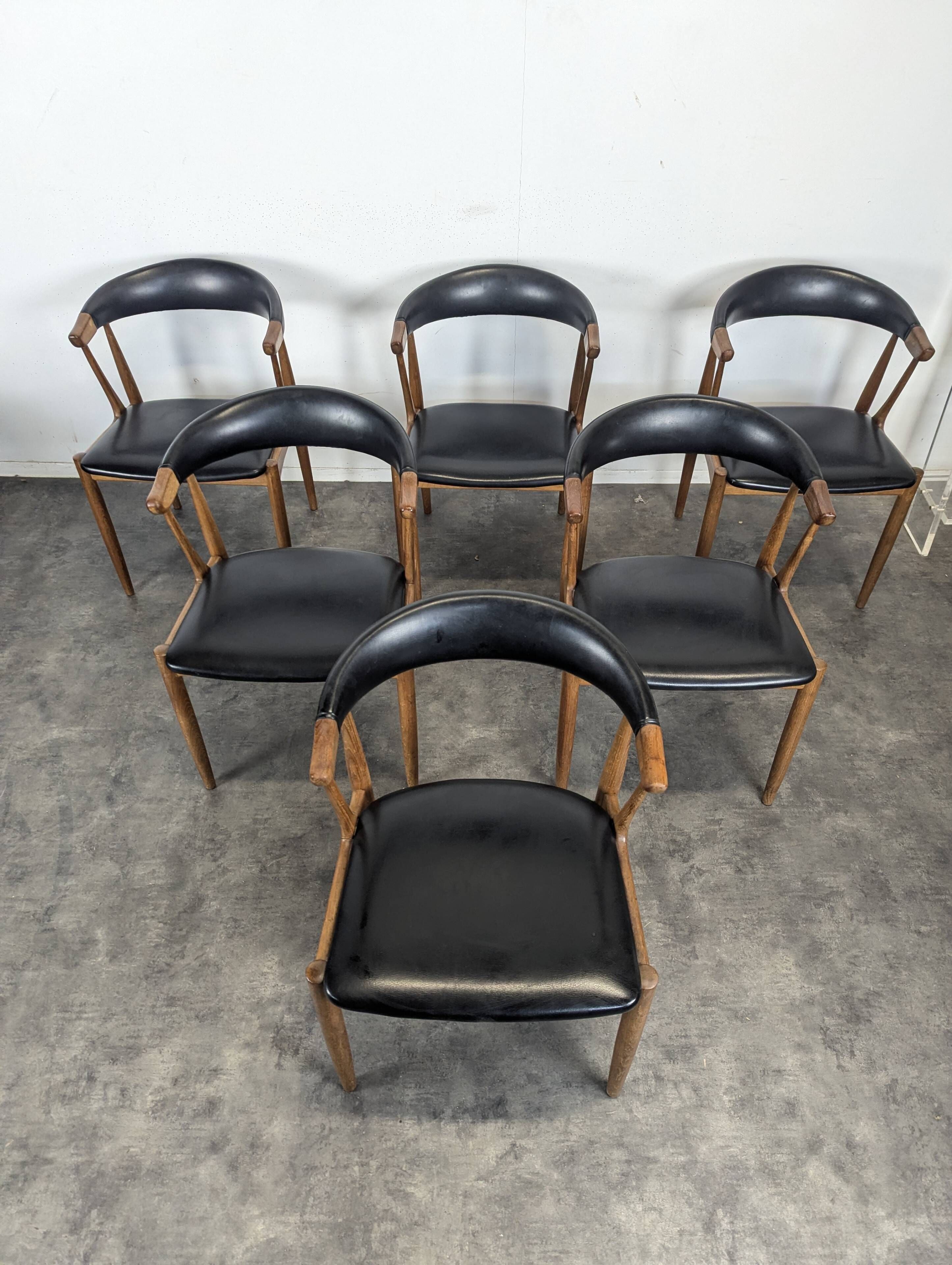 Set of 6 BA113 chairs by Johannes Andersen for Brdr. Andersens Møbelfabrik in teak and black skai.