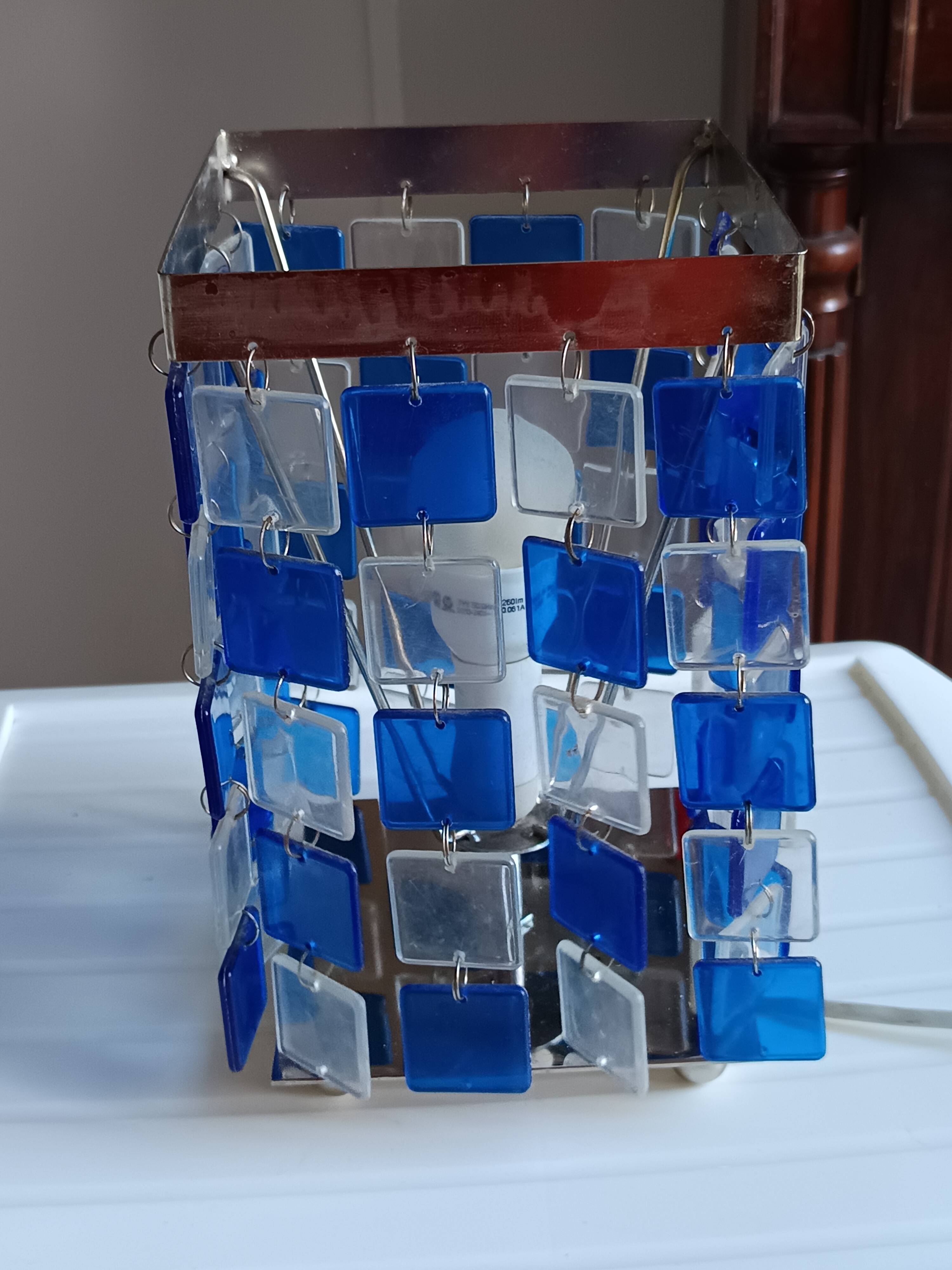 1970s designer table lamp with blue and clear plexiglass pendants.