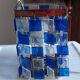 1970s designer table lamp with blue and clear plexiglass pendants.