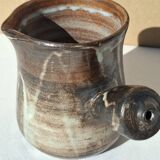 Stoneware pitcher signed by Jacques Pouchain.