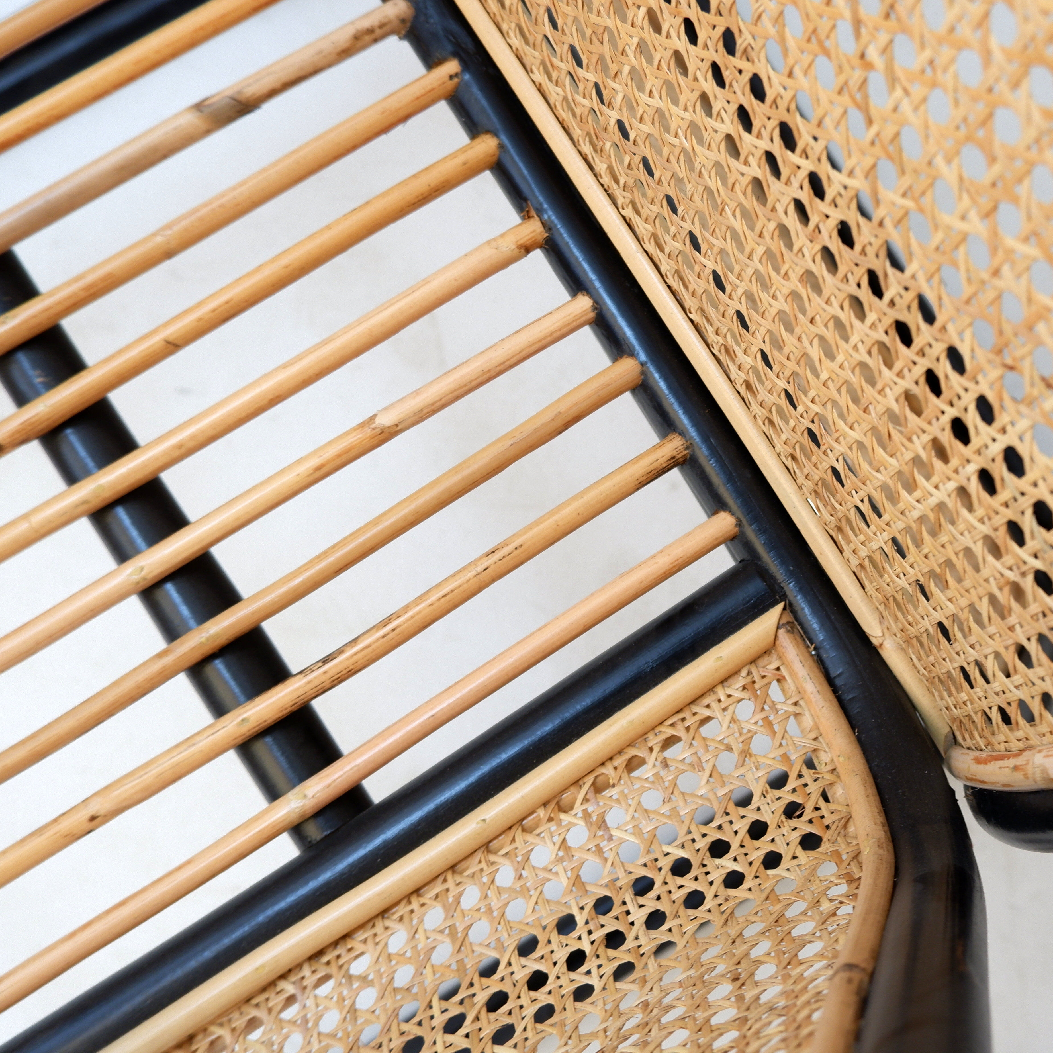 Pair of designer armchairs in curved wood and wicker